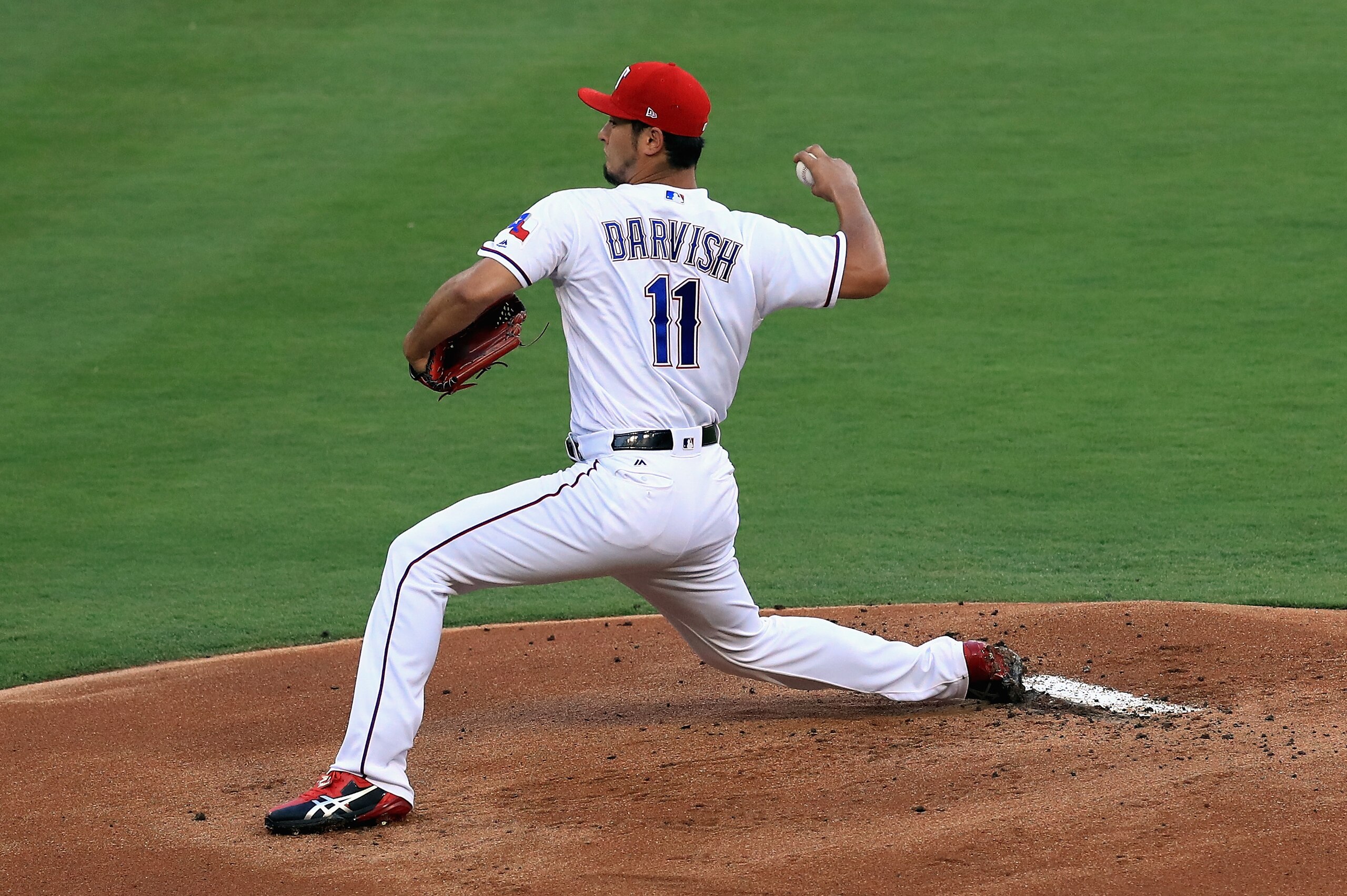 ARLINGTON, TX - JULY 26:  Yu Darvish #11 of the Texas Rangers throws against the Miami Marlins in the first inning at Globe Life Park in Arlington on July 26, 2017 in Arlington, Texas.  (Photo by Ronald Martinez/Getty Images)