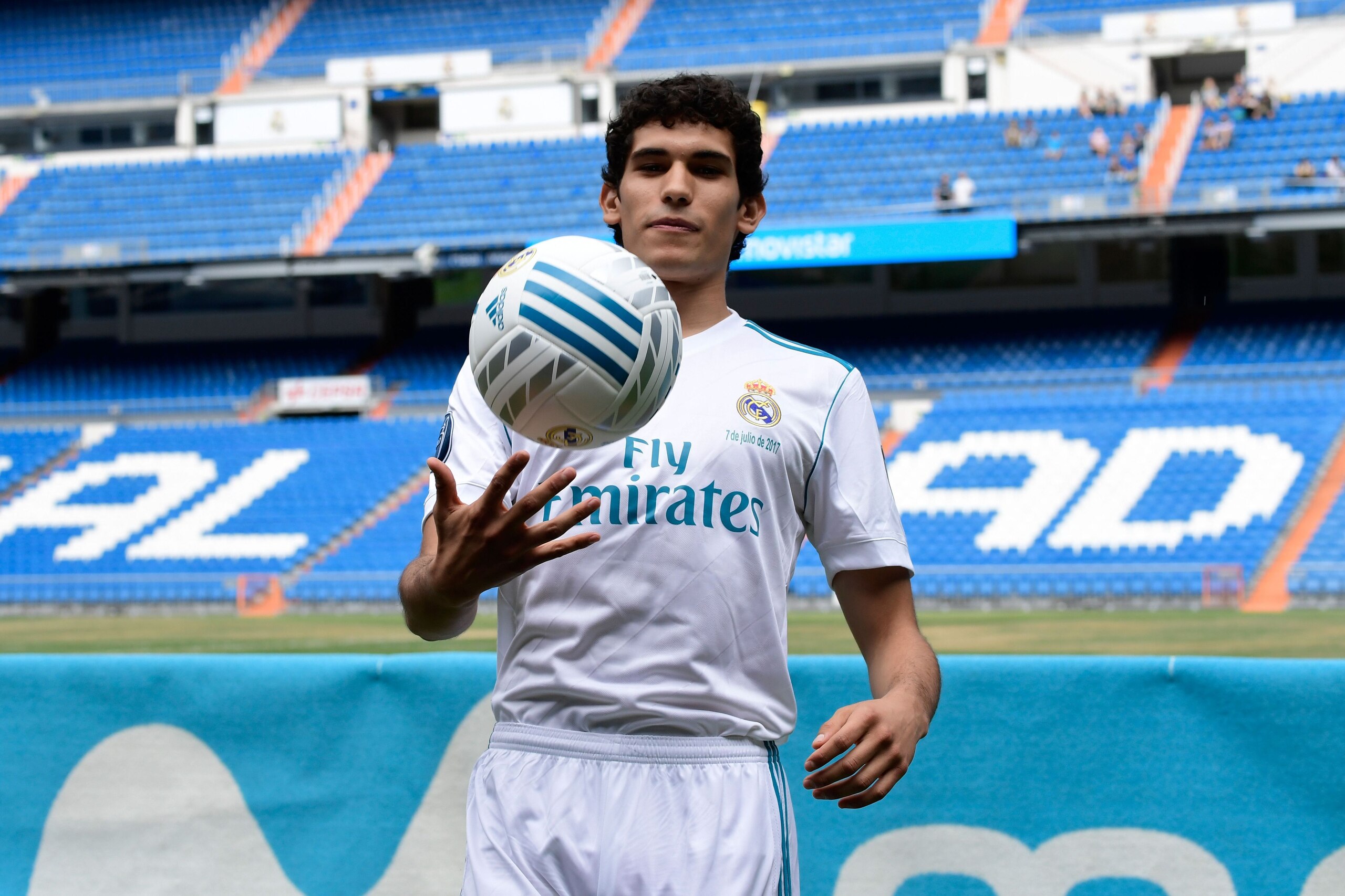 Real Madrid's new player Jesus Vallejo plays with a ball after his official presentation at the Santiago Bernabeu stadium in Madrid, on July 7, 2017. / AFP PHOTO / JAVIER SORIANO        (Photo credit should read JAVIER SORIANO/AFP/Getty Images)