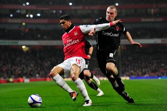 Arsenal's Brazilian midfielder Denilson (L) vies with Leyton Orient's Republic of Ireland midfielder Stephen Dawson (R) during their FA Cup fifth round replay football match against Leyton Orient at the Emirates Stadium, London, England, on March 2, 2011.