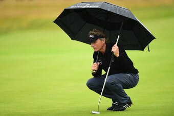BRIDGEND, WALES - JULY 29:  Bernhard Langer of Germany lines up a putt on the  18th green during the third round of the Senior Open Championship presented by Rolex at Royal Porthcawl Golf Club on July 29, 2017 in Bridgend, Wales.  (Photo by Richard Martin