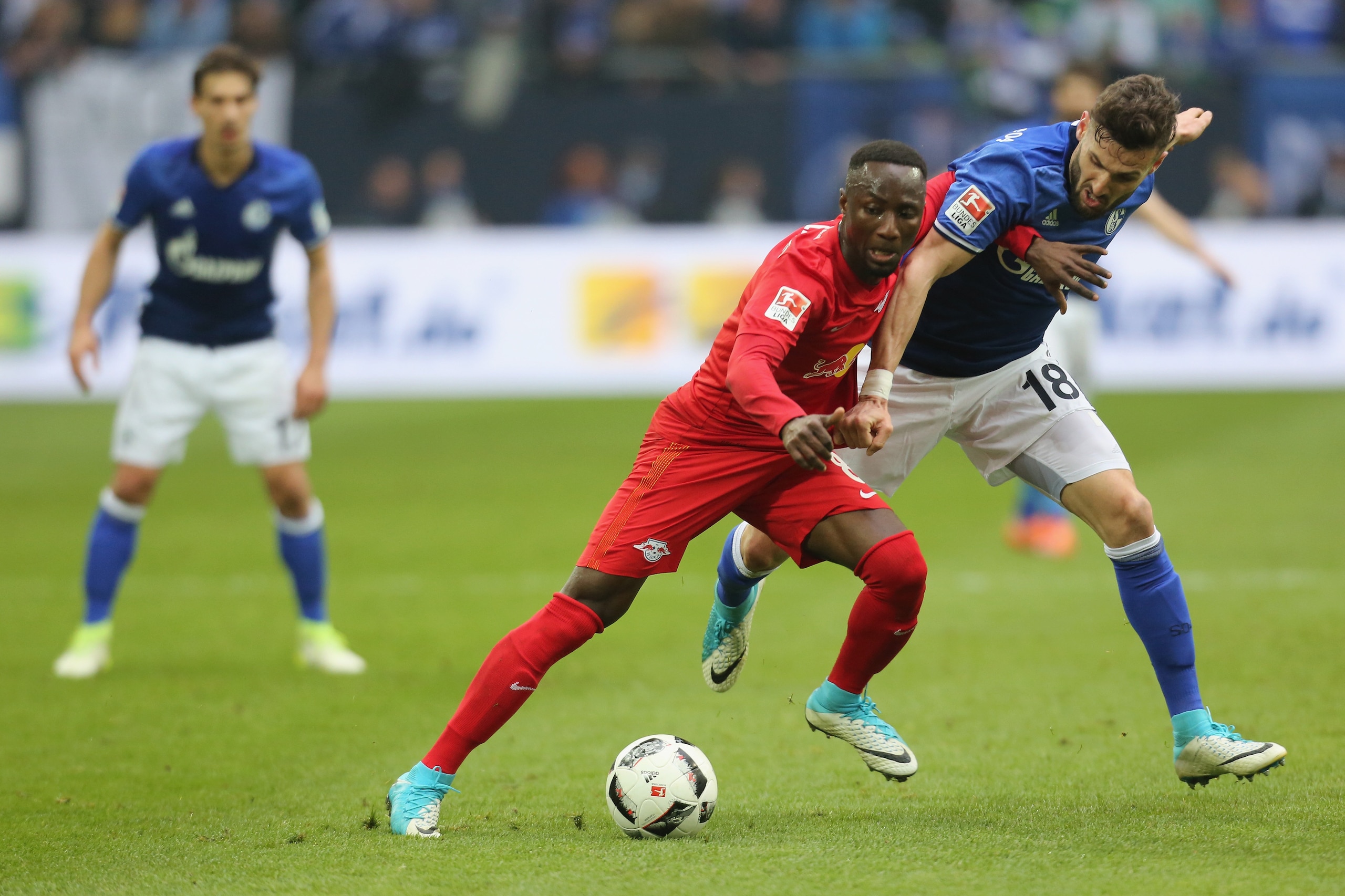 GELSENKIRCHEN, GERMANY - APRIL 23: Daniel Caligiuri of Schalke and Naby Deco Keita of Leipzig battle for the ball during the Bundesliga match between FC Schalke 04 and RB Leipzig at Veltins-Arena on April 23, 2017 in Gelsenkirchen, Germany. (Photo by TF-I GELSENKIRCHEN, GERMANY - APRIL 23: Daniel Caligiuri of Schalke and Naby Deco Keita of Leipzig battle for the ball during the Bundesliga match between FC Schalke 04 and RB Leipzig at Veltins-Arena on April 23, 2017 in Gelsenkirchen, Germany. (Photo by TF-I