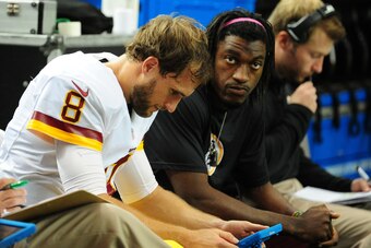 ATLANTA, GA - OCTOBER 11: Kirk Cousins #8 and Robert Griffin III of the Washington Redskins go over game notes during the game against the Atlanta Falcons at the Georgia Dome on October 11, 2015 in Atlanta, Georgia. (Photo by Scott Cunningham/Getty Images