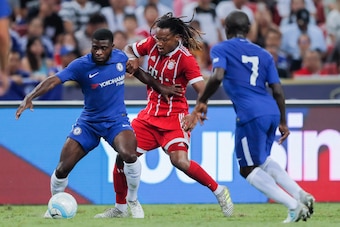 SINGAPORE, SINGAPORE - JULY 25: Bayern Munich Midfielder Renato Sanches (C) fights for the ball with Chelsea Midfielder Jeremie Boga (R) during the International Champions Cup match between Chelsea FC and FC Bayern Munich at National Stadium on July 25, 2