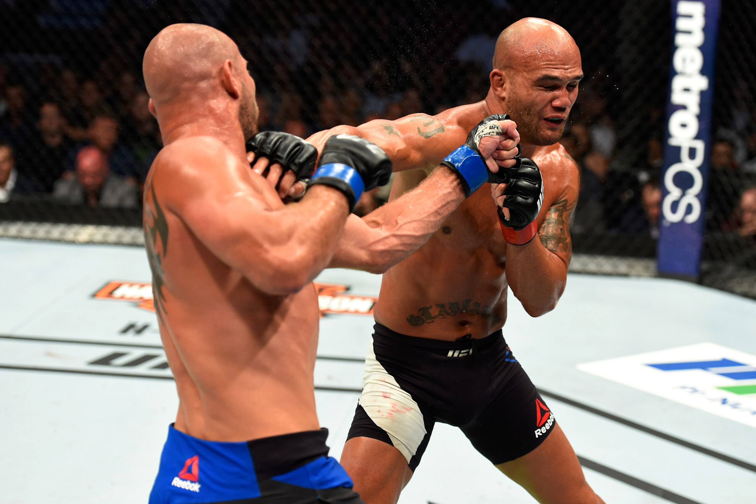 ANAHEIM, CA - JULY 29:  Robbie Lawler and Donald Cerrone trade punches in their welterweight bout during the UFC 214 event at Honda Center on July 29, 2017 in Anaheim, California.  (Photo by Josh Hedges/Zuffa LLC/Zuffa LLC via Getty Images)