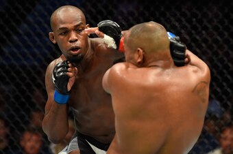 ANAHEIM, CA - JULY 29:  Jon Jones punches Daniel Cormier in their UFC light heavyweight championship bout during the UFC 214 event at Honda Center on July 29, 2017 in Anaheim, California.  (Photo by Josh Hedges/Zuffa LLC/Zuffa LLC via Getty Images)