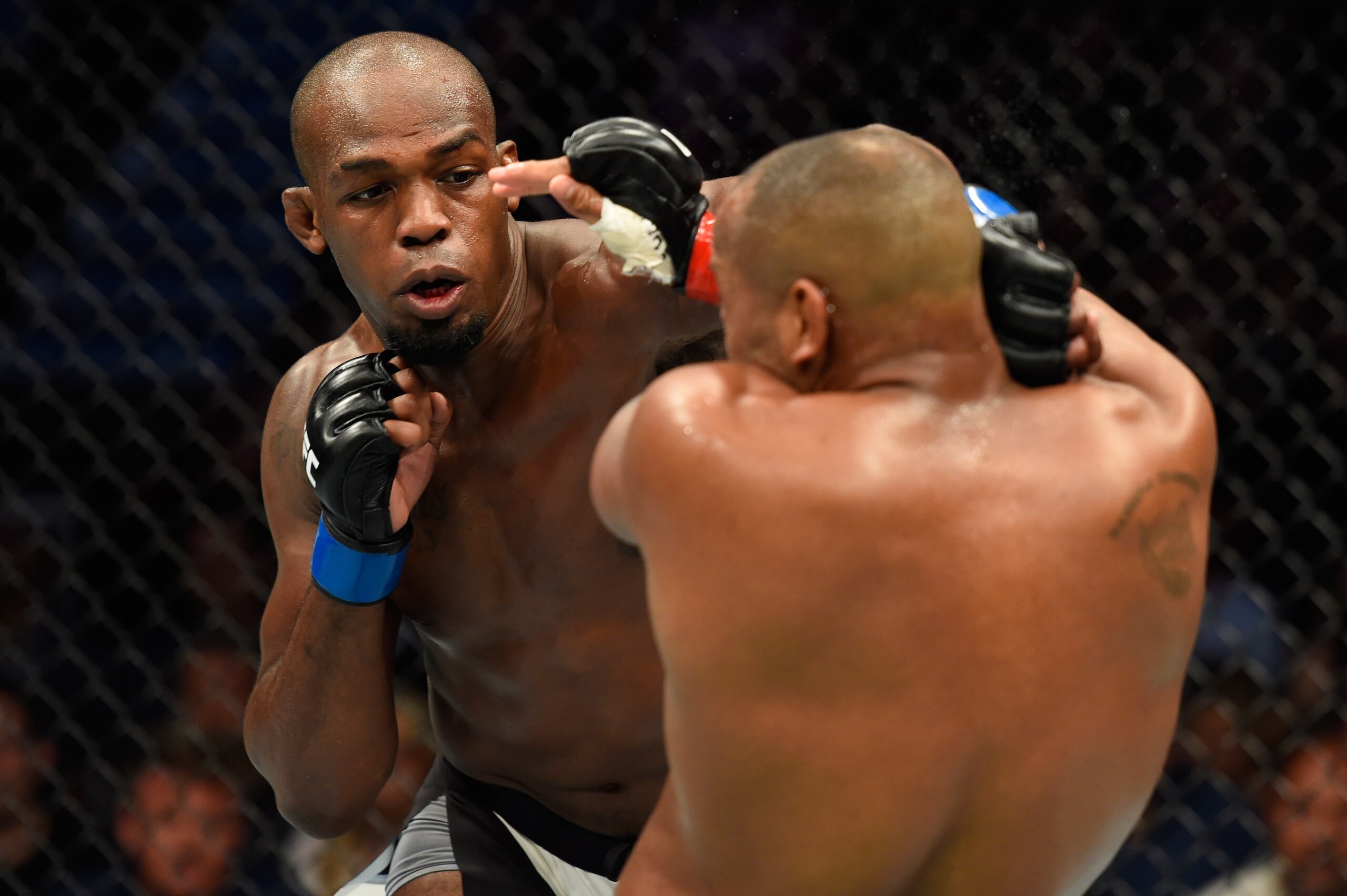 ANAHEIM, CA - JULY 29:  Jon Jones punches Daniel Cormier in their UFC light heavyweight championship bout during the UFC 214 event at Honda Center on July 29, 2017 in Anaheim, California.  (Photo by Josh Hedges/Zuffa LLC/Zuffa LLC via Getty Images)
