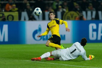 DORTMUND, GERMANY - MARCH 08:  Christian Pulisic of Borussia Dortmund scores a goal during the UEFA Champions League Round of 16: Second Leg match between Borussia Dortmund and SL Benfica at Signal Iduna Park on March 08, 2017 in Dortmund, Germany. (Photo