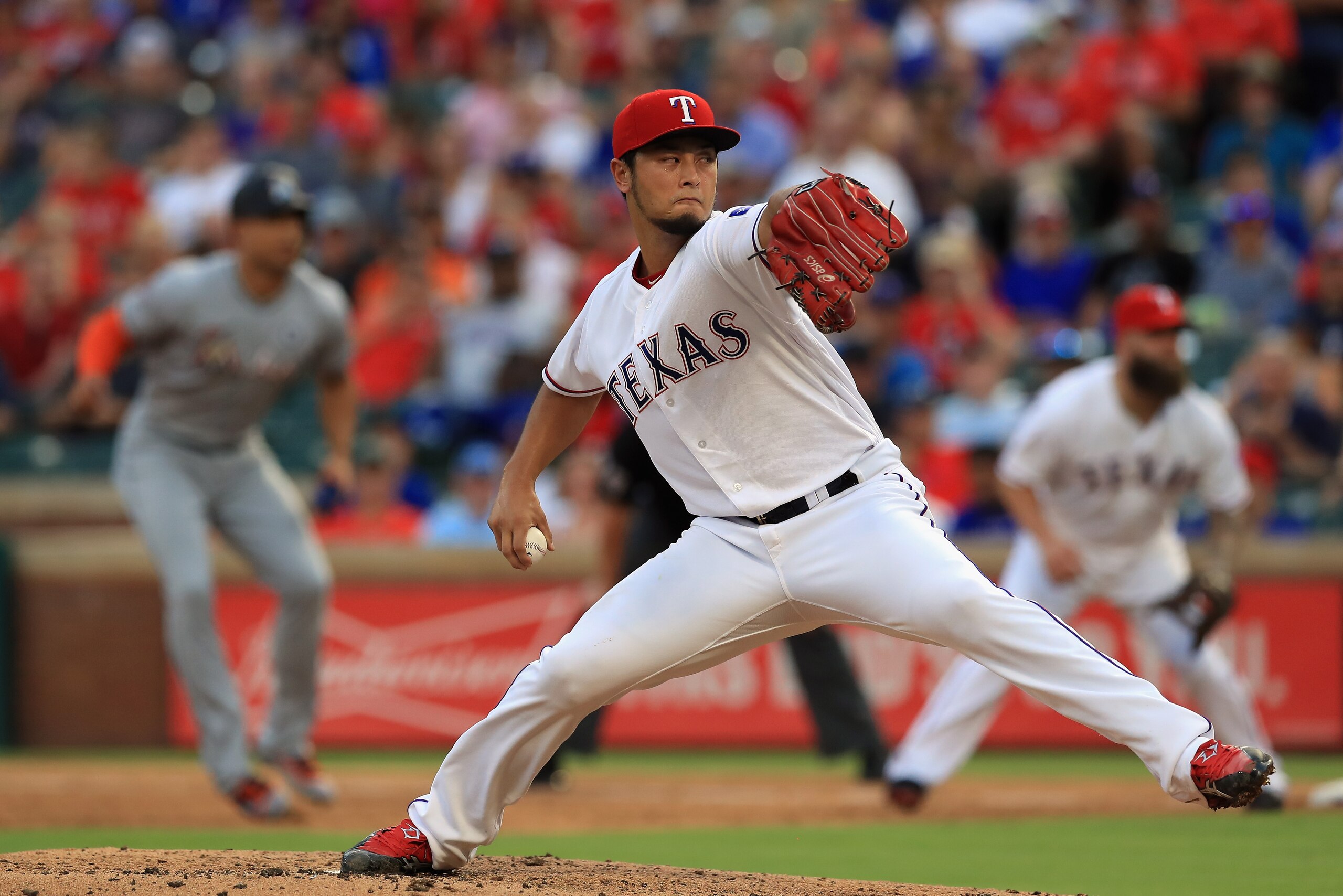 ARLINGTON, TX - JULY 26:  Yu Darvish #11 of the Texas Rangers throws against the Miami Marlins in the fourth inning at Globe Life Park in Arlington on July 26, 2017 in Arlington, Texas.  (Photo by Ronald Martinez/Getty Images)