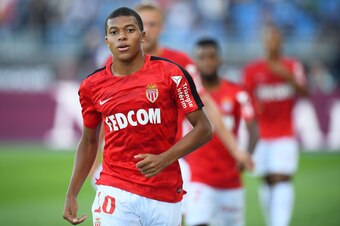 Monaco's French forward Kylian Mbappe warms up ahead of the French Trophy of Champions (Trophee des Champions) football match between Monaco (ASM) and Paris Saint-Germain (PSG) on July 29, 2017, at the Grand Stade in Tangiers. / AFP PHOTO / FRANCK FIFE   