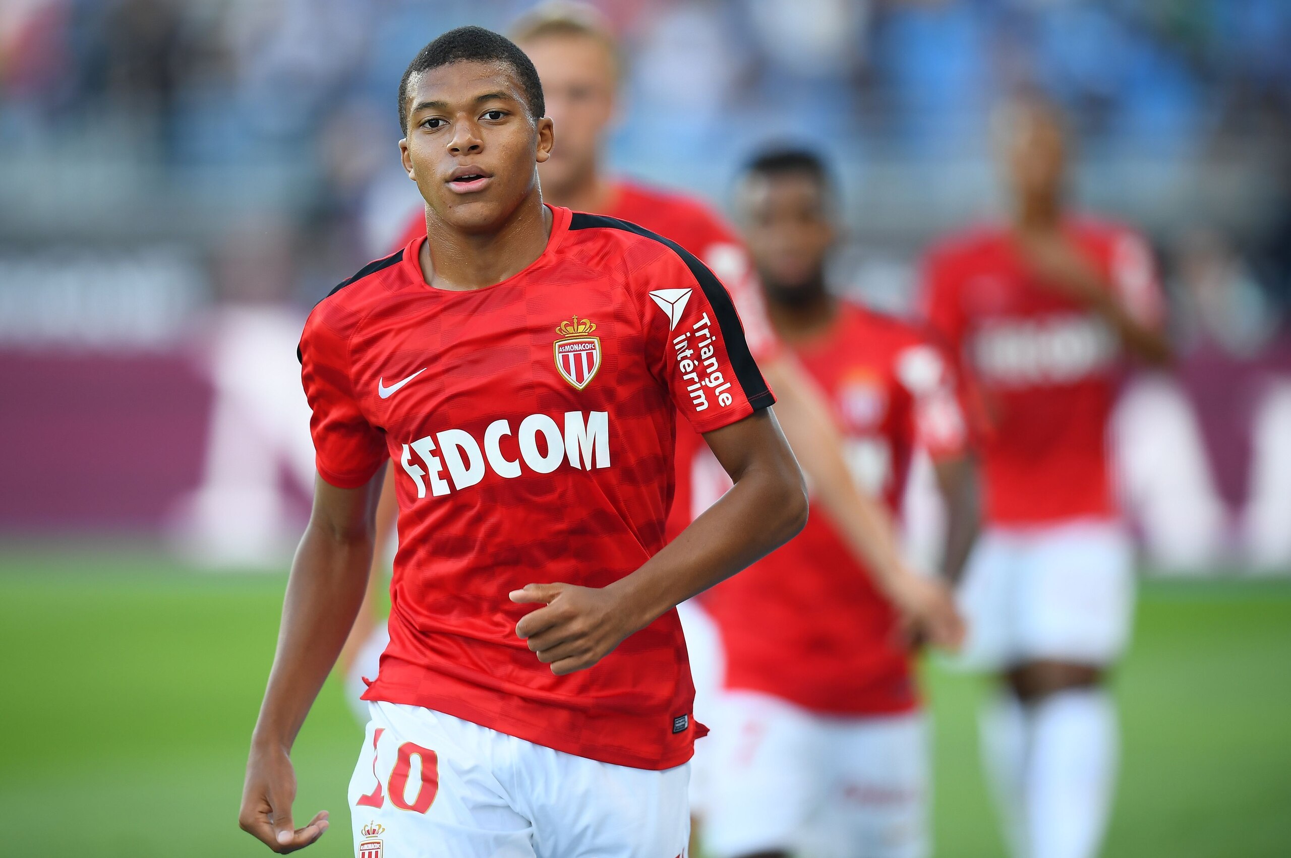 Monaco's French forward Kylian Mbappe warms up ahead of the French Trophy of Champions (Trophee des Champions) football match between Monaco (ASM) and Paris Saint-Germain (PSG) on July 29, 2017, at the Grand Stade in Tangiers. / AFP PHOTO / FRANCK FIFE   