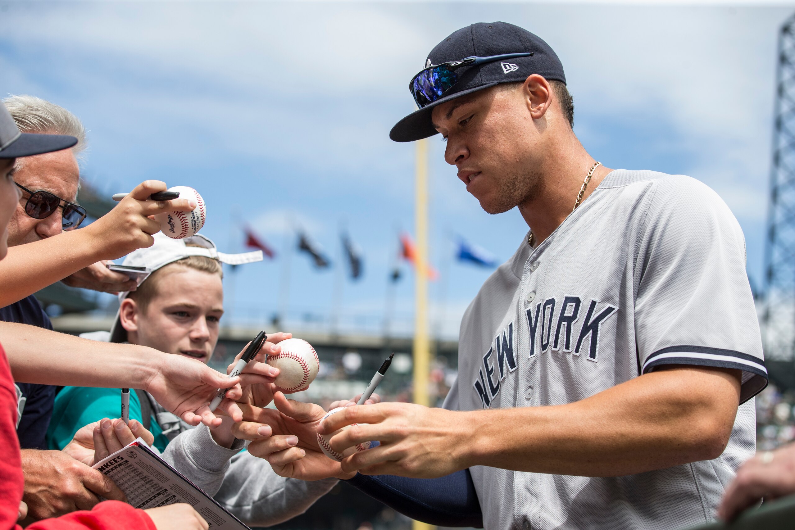 SEATTLE, WA - JULY 23: Aaron Judge #99 of the New York Yankees signs autographs for fans before a game against the Seattle Mariners at Safeco Field on July 23, 2017 in Seattle, Washington. The Yankees won 6-4. (Photo by Stephen Brashear/Getty Images)