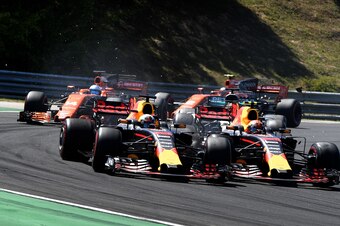 Red Bull's Australian driver Daniel Ricciardo (L) and Red Bull's Dutch driver Max Verstappen (R) collide as they race at the Hungaroring circuit in Budapest on July 30, 2017, during the Formula One Hungarian Grand Prix.  / AFP PHOTO / ANDREJ ISAKOVIC     