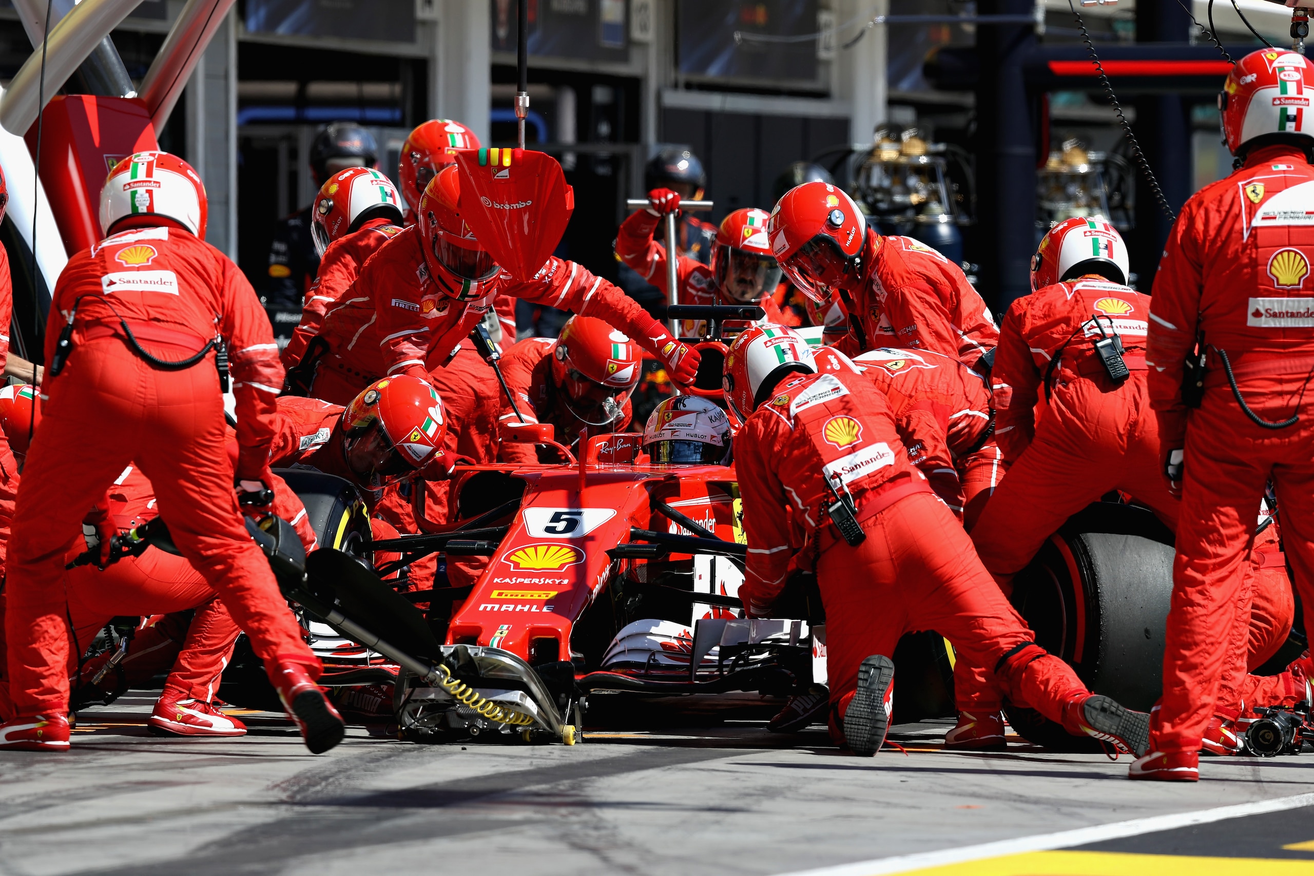 BUDAPEST, HUNGARY - JULY 30:  Sebastian Vettel of Germany driving the (5) Scuderia Ferrari SF70H makes a pit stop for new tyres during the Formula One Grand Prix of Hungary at Hungaroring on July 30, 2017 in Budapest, Hungary.  (Photo by Mark Thompson/Get
