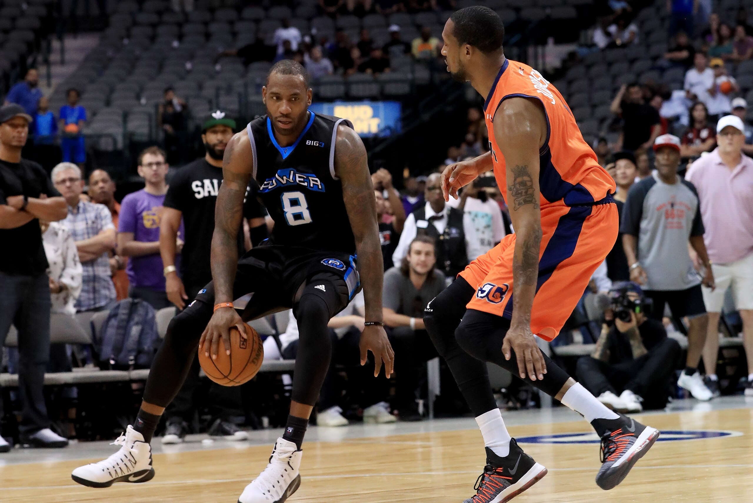 DALLAS, TX - JULY 30:   Rasual Butler #8 of Power dribbles the ball while being guarded by DerMarr Johnson #1 of 3s Company during week six of the BIG3 three on three basketball league at American Airlines Center on July 30, 2017 in Dallas, Texas. (Photo 