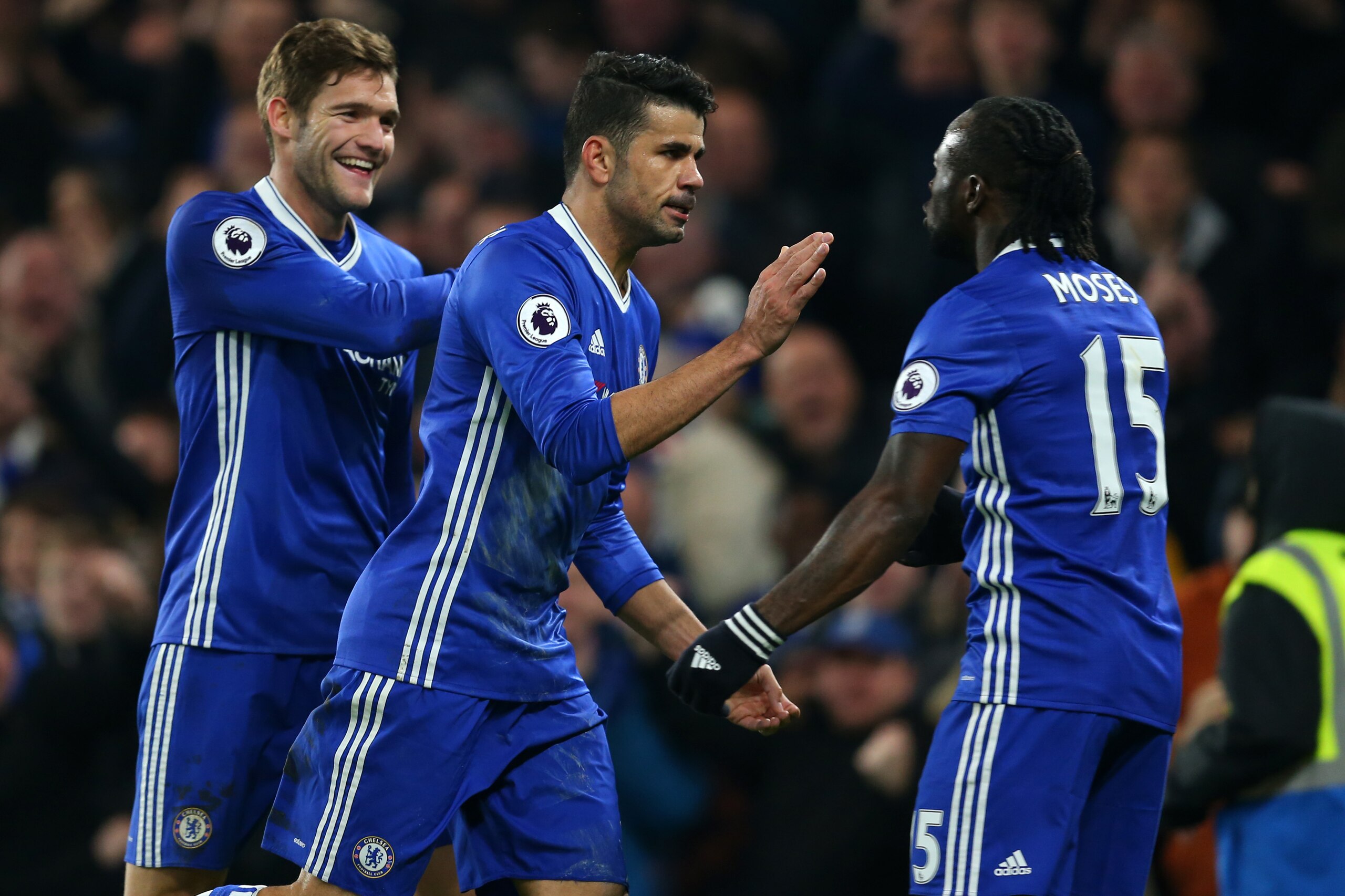 LONDON, ENGLAND - JANUARY 22: Diego Costa of Chelsea celebrates after scoring to make it 1-0 with Marcos Alonso and Victor Moses of Chelsea during the Premier League match between Chelsea and Hull City at Stamford Bridge on January 22, 2017 in London, Eng