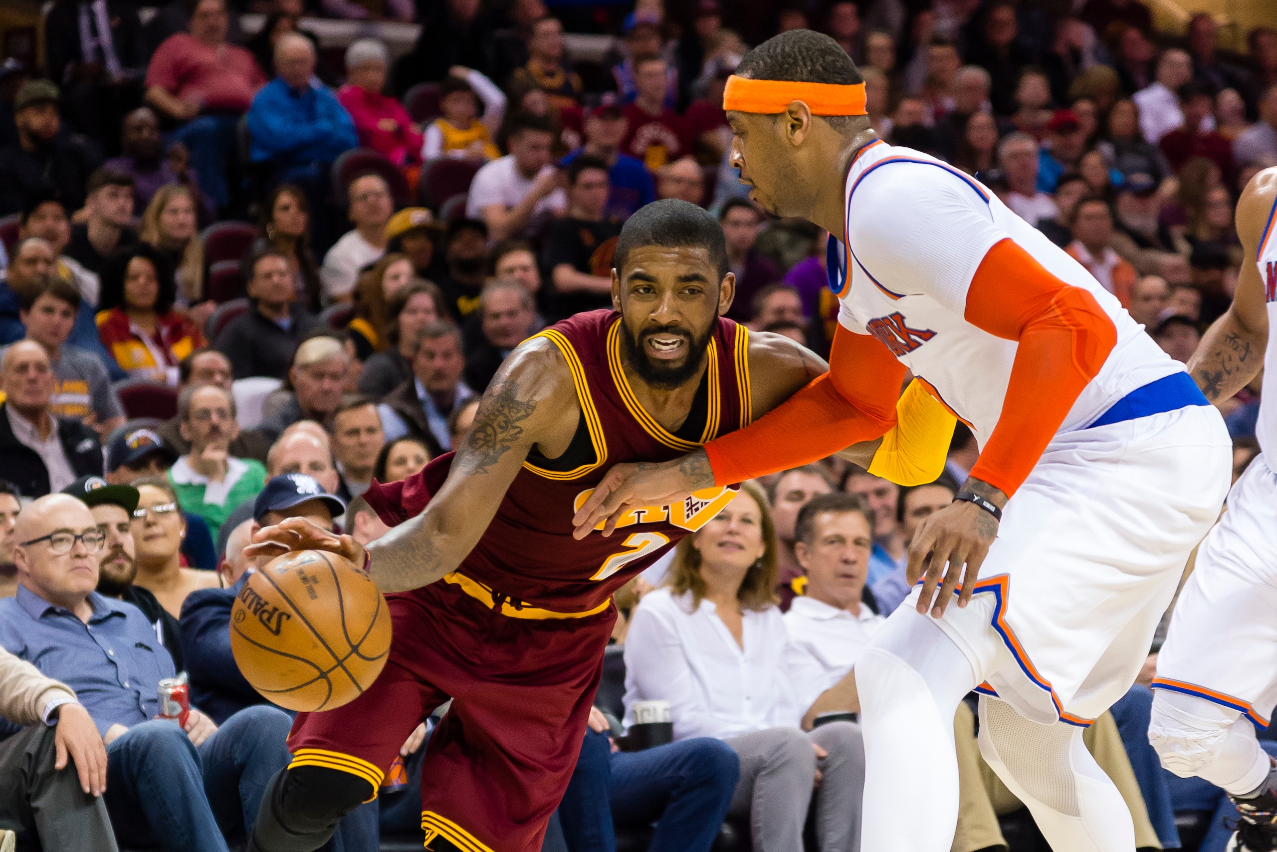 CLEVELAND, OH - FEBRUARY 23: Kyrie Irving #2 of the Cleveland Cavaliers drives around Carmelo Anthony #7 of the New York Knicks during the second half at Quicken Loans Arena on February 23, 2017 in Cleveland, Ohio. The Cavaliers defeated the Knicks 119-10