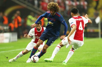 STOCKHOLM, SWEDEN - MAY 24: Marouane Fellaini of Manchester United vies with Jairo Riedewald of Ajax during the UEFA Europa League Final match between Ajax and Manchester United at Friends Arena on May 24, 2017 in Stockholm, Sweden. (Photo by Ian MacNicol