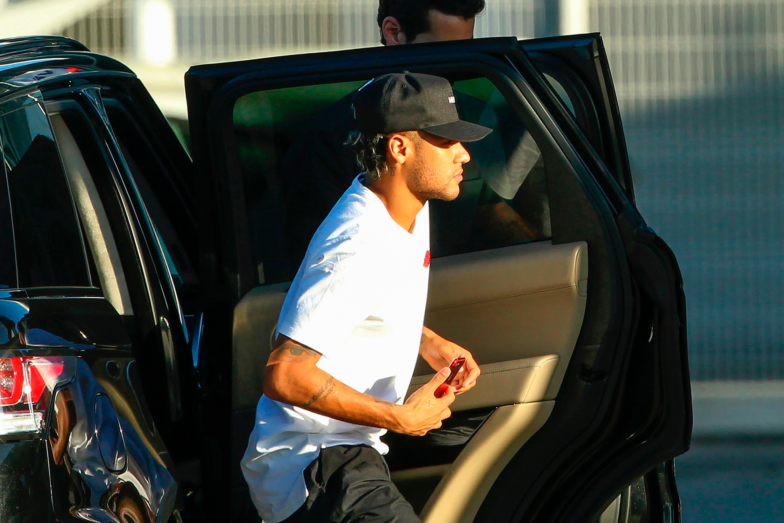Brazilian football player Neymar is pictured upon his arrival at Francisco Sa Carneiro airport on the outskirts of Porto, during a stop over from Barcelona with his private jet on August 2, 2017.
Neymar could be presented as a Paris Saint-Germain player a