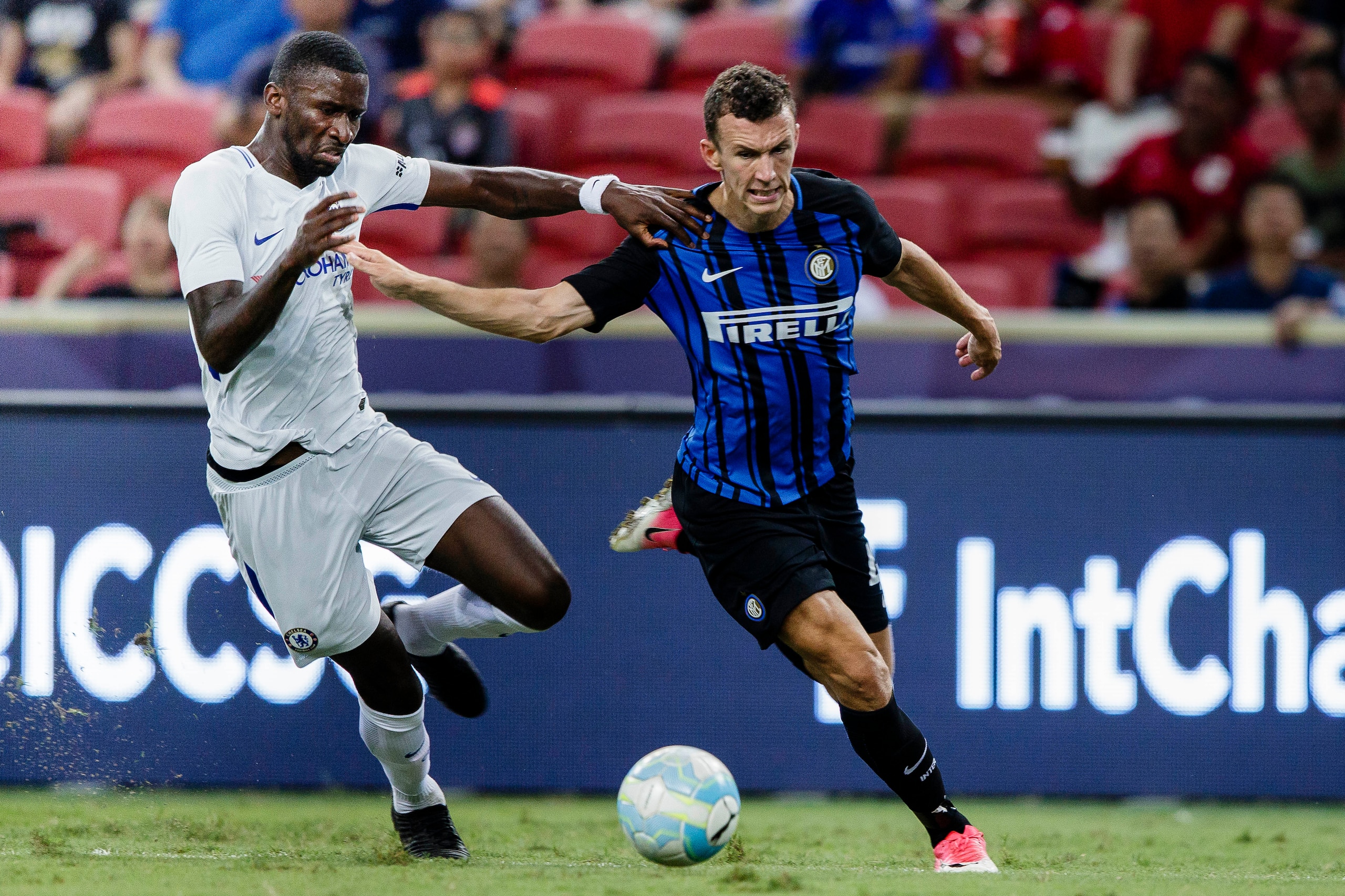 SINGAPORE, SINGAPORE - JULY 29: FC Internazionale Forward Ivan Perisic (R) fights for the ball with Chelsea Defender Antonio Rudiger (L) during the International Champions Cup 2017 match between FC Internazionale and Chelsea FC on July 29, 2017 in Singapo SINGAPORE, SINGAPORE - JULY 29: FC Internazionale Forward Ivan Perisic (R) fights for the ball with Chelsea Defender Antonio Rudiger (L) during the International Champions Cup 2017 match between FC Internazionale and Chelsea FC on July 29, 2017 in Singapo