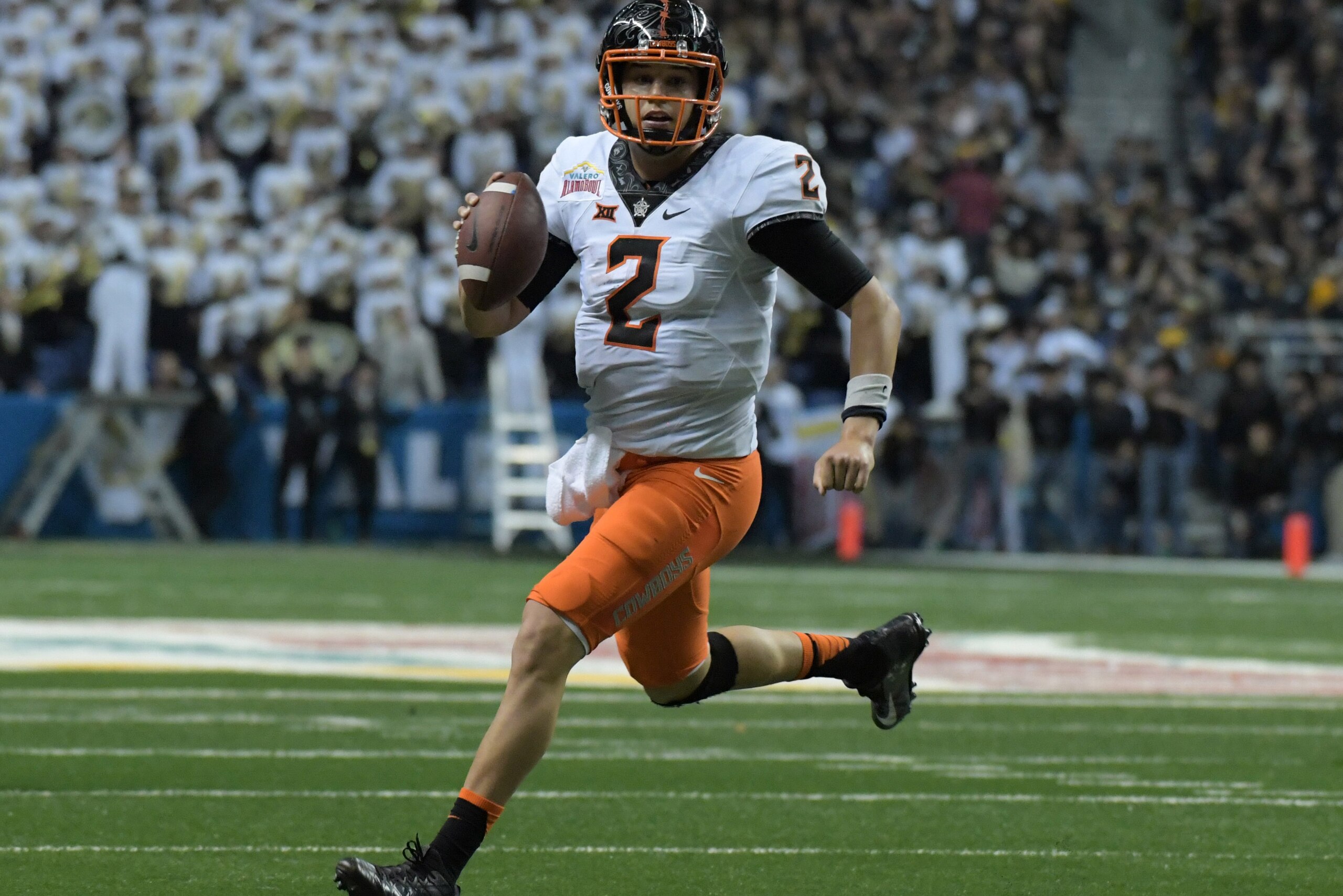 Dec 29, 2016; San Antonio, TX, USA; Oklahoma State Cowboys quarterback Mason Rudolph (2) looks to pass in the third quarter against the Colorado Buffaloes during the 2016 Alamo Bowl at Alamodome. Mandatory Credit: Kirby Lee-USA TODAY Sports