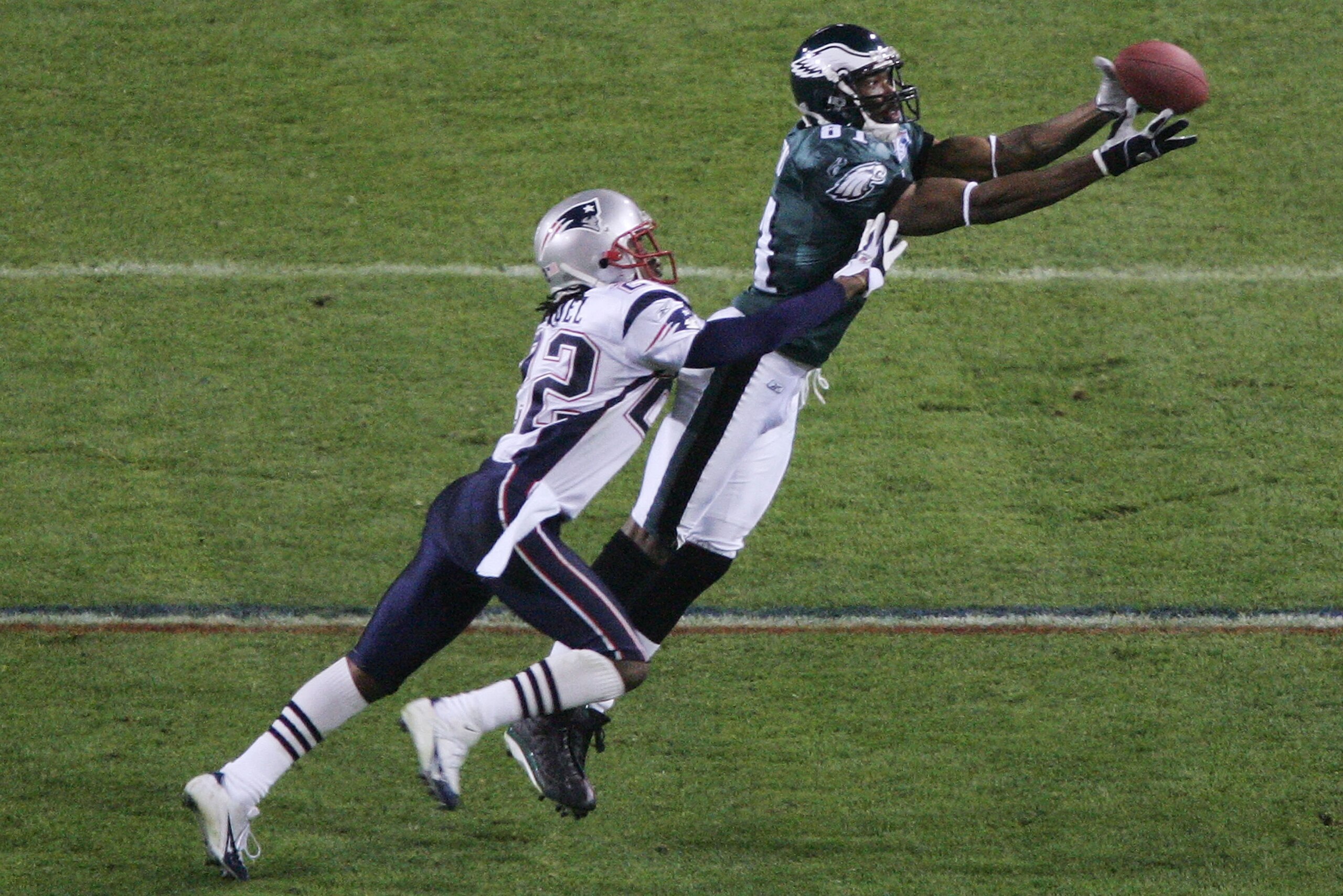 JACKSONVILLE, FLORIDA - FEBRUARY 06:  Wide receiver Terrell Owens #81 of the Philadelphia Eagles catches a 10-yard pass against Asante Samuel #22 of the New England Patriots during the fourth quarter of Super Bowl XXXIX at Alltel Stadium on February 6, 20