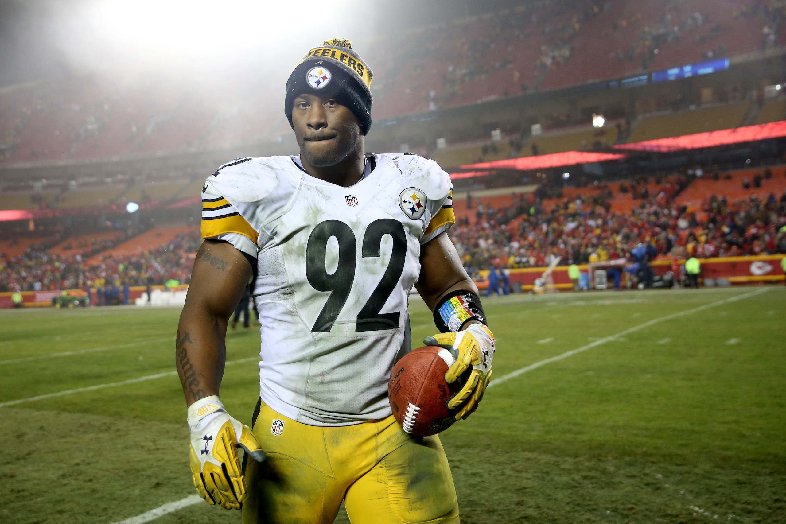 KANSAS CITY, MP - JANUARY 15: Outside linebacker James Harrison #92 of the Pittsburgh Steelers walks off of the field with a Sunday Night Football game ball following the Steelers victory over the Kansas City Chiefs in the AFC Divisional Playoff game at A