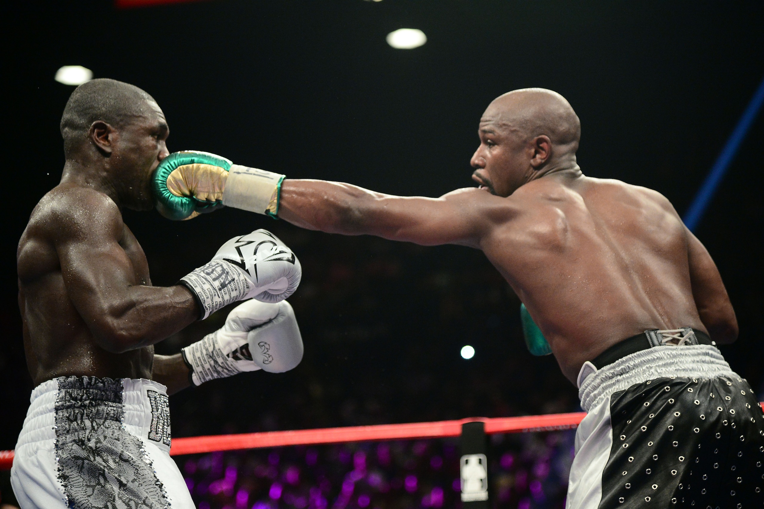 Sep 12, 2015; Las Vegas, NV, USA; Floyd Mayweather (black trunks) and Andre Berto (white trunks) box during their WBA/WBC welterweight title bout at MGM Grand Garden Arena. Mayweather won via unanimous decision. Mandatory Credit: Joe Camporeale-USA TODAY Sep 12, 2015; Las Vegas, NV, USA; Floyd Mayweather (black trunks) and Andre Berto (white trunks) box during their WBA/WBC welterweight title bout at MGM Grand Garden Arena. Mayweather won via unanimous decision. Mandatory Credit: Joe Camporeale-USA TODAY