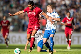 BERLIN, GERMANY - JULY 29:  Emre Can of Liverpool FC is challenged by Mitchell Weiser of Hertha BSC during the Preseason Friendly match between Hertha BSC and FC Liverpool at Olympiastadion on July 29, 2017 in Berlin, Germany.  (Photo by Boris Streubel/Ge
