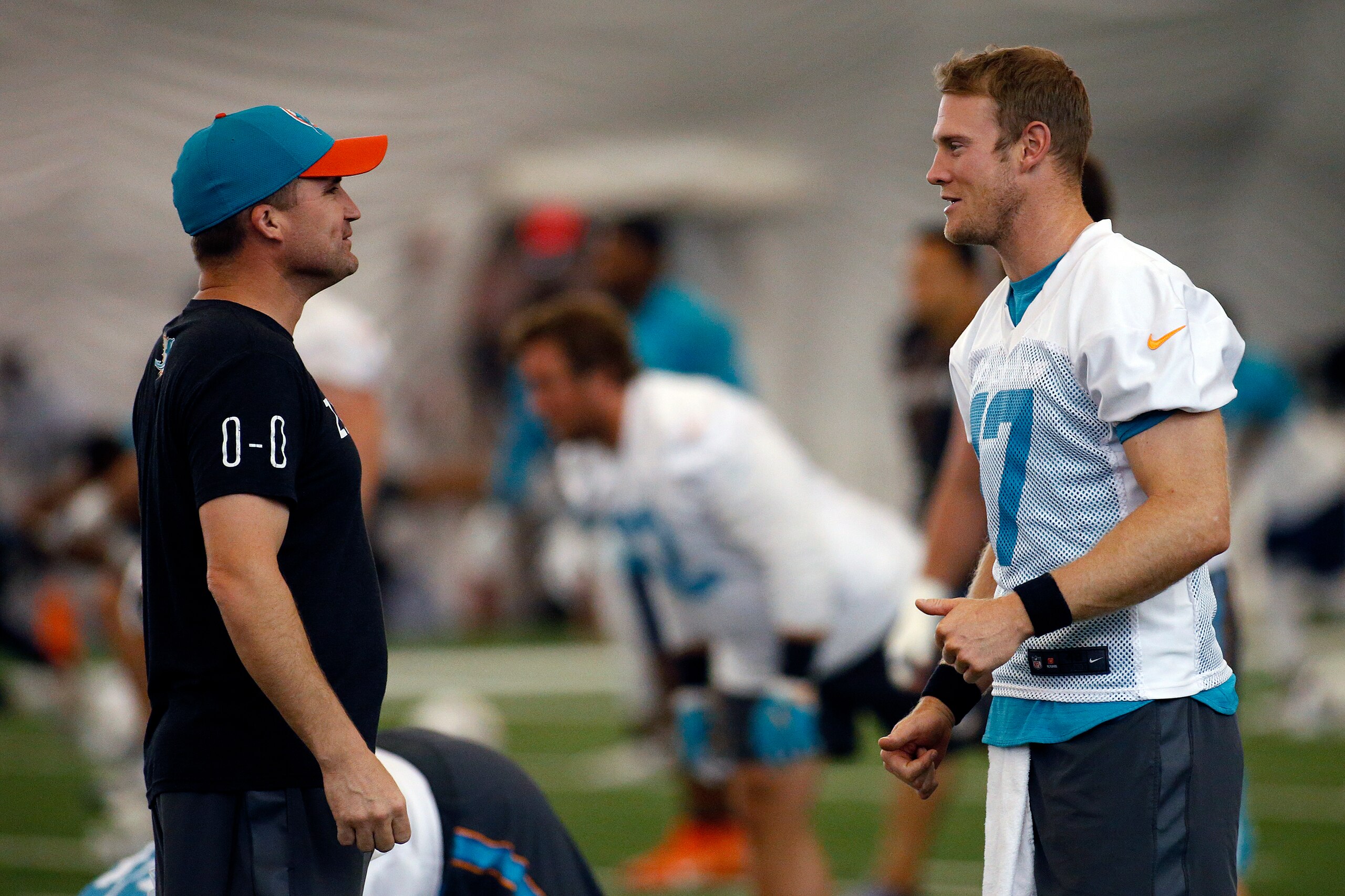 DAVIE, FL - MAY 25: Ryan Tannehill #17 talks to associate head coach / special teams coordinator Darren Rizzi of the Miami Dolphins during the teams OTA's on May 25, 2017 at the Miami Dolphins training facility in Davie, Florida. (Photo by Joel Auerbach/G