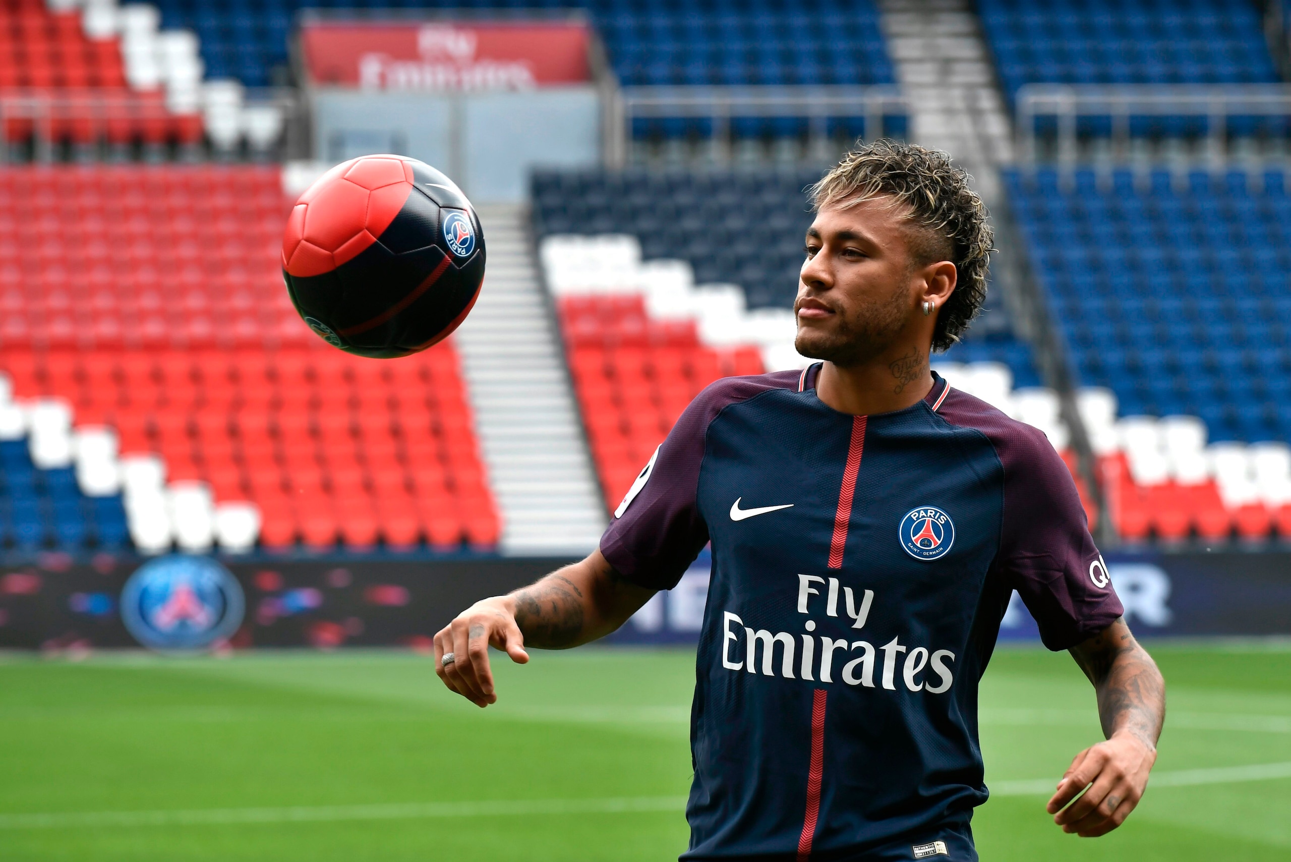 Brazilian superstar Neymar plays with a ball during his official presentation at the Parc des Princes stadium on August 4, 2017 in Paris after agreeing a five-year contract following his world record 222 million euro ($260 million) transfer from Barcelona Brazilian superstar Neymar plays with a ball during his official presentation at the Parc des Princes stadium on August 4, 2017 in Paris after agreeing a five-year contract following his world record 222 million euro ($260 million) transfer from Barcelona