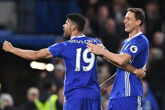 Chelsea's Brazilian-born Spanish striker Diego Costa (L) celebrates with Chelsea's Serbian midfielder Nemanja Matic after scoring their third goal during the English Premier League football match between Chelsea and Southampton at Stamford Bridge in Londo