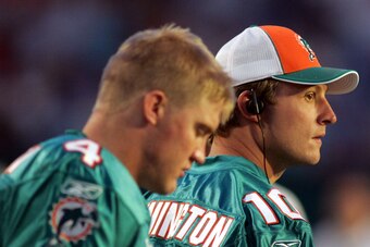 MIAMI - AUGUST 09:  Quarterback Chad Pennington #10 of the Miami Dolphins stands with quarterback Josh McCown #4 during a pre season game against the Tampa Bay Buccaneers August 9, 2008 at Dolphin Stadium in Miami, Florida.  (Photo by Marc Serota/Getty Im
