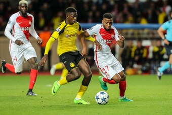 MONACO, MONACO - APRIL 19: Ousmane Dembele of Dortmund and Thomas Lemar of Monaco battle for the ball during the UEFA Champions League quarter final second leg match between AS Monaco and Borussia Dortmund of Dortmund at Stade Louis II on April 19, 2017 i