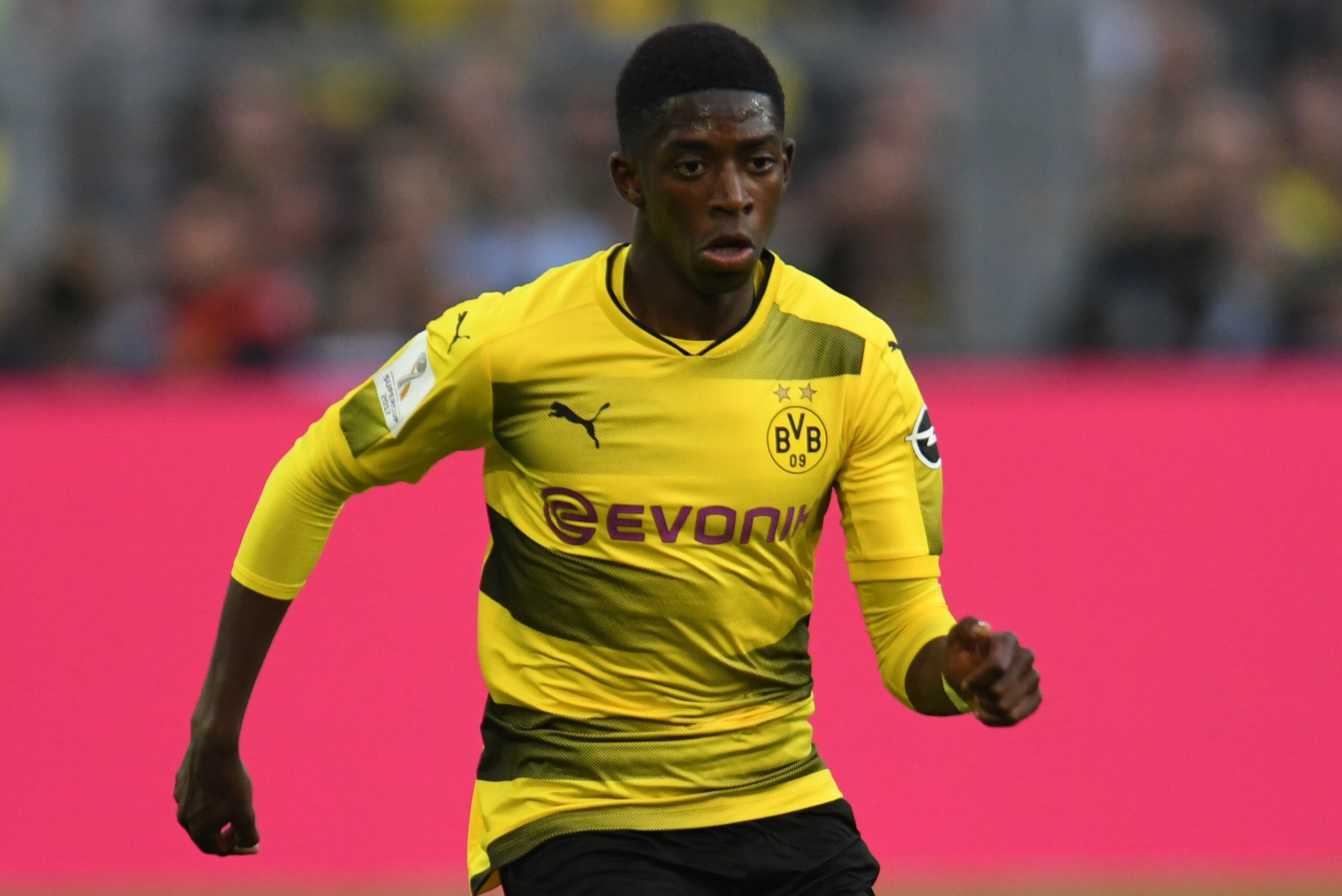 Dortmund's French midfielder Ousmane Dembelé plays the ball during the German Supercup football match between Borussia Dortmund vs Bayern Munich in Dortmund, western Germany, on August 5, 2017. / AFP PHOTO / PATRIK STOLLARZ        (Photo credit should rea