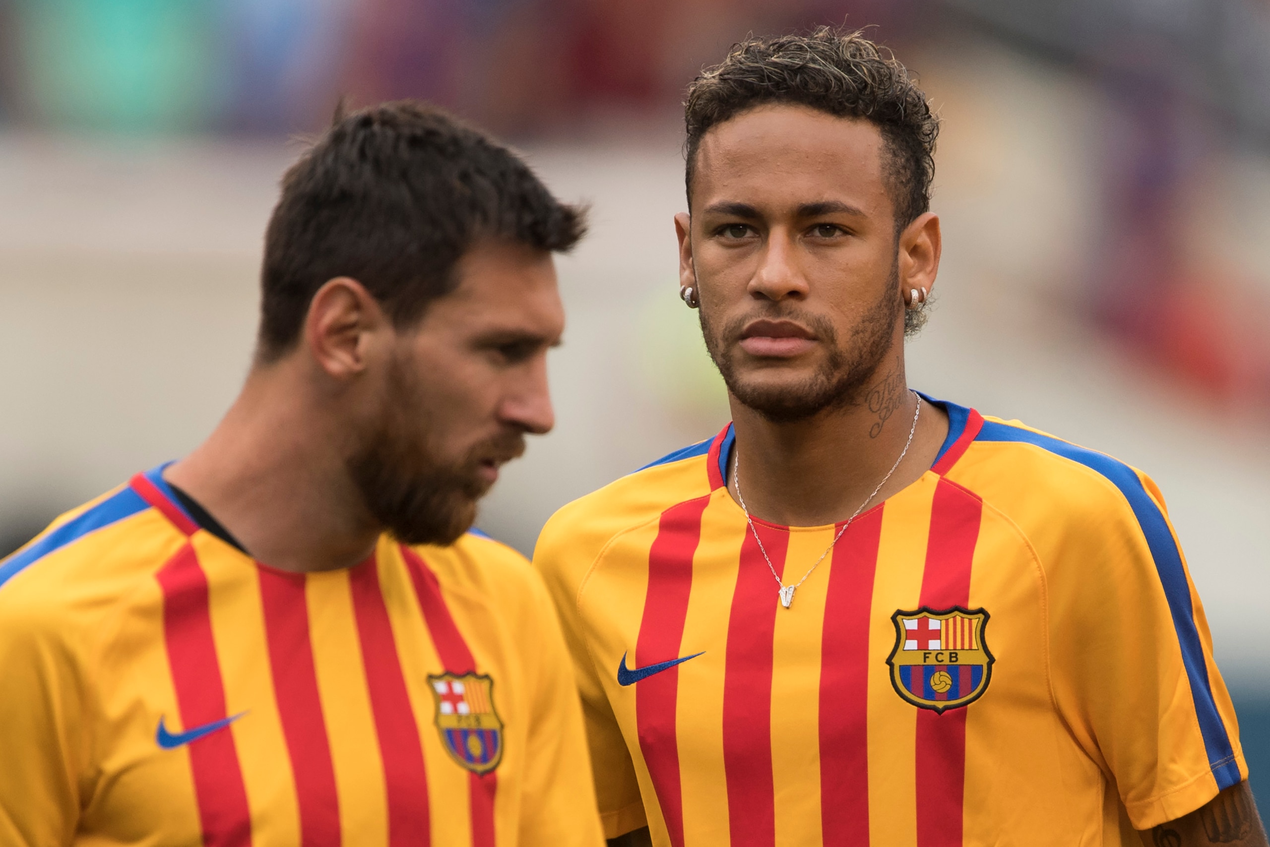 (FILES) This file photo taken on July 22, 2017 shows Neymar (R) and Lionel Messi (L) of FC Barcelona warming up before the International Champions Cup (ICC)  match between Juventus FC and FC Barcelona at the Met Life Stadium in East Rutherford, New Jersey