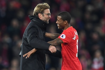 Liverpool's German manager Jurgen Klopp (L) celebrates on the pitch with goalscorer Liverpool's Dutch midfielder Georginio Wijnaldum after the English Premier League football match between Liverpool and Manchester City at Anfield in Liverpool, north west 