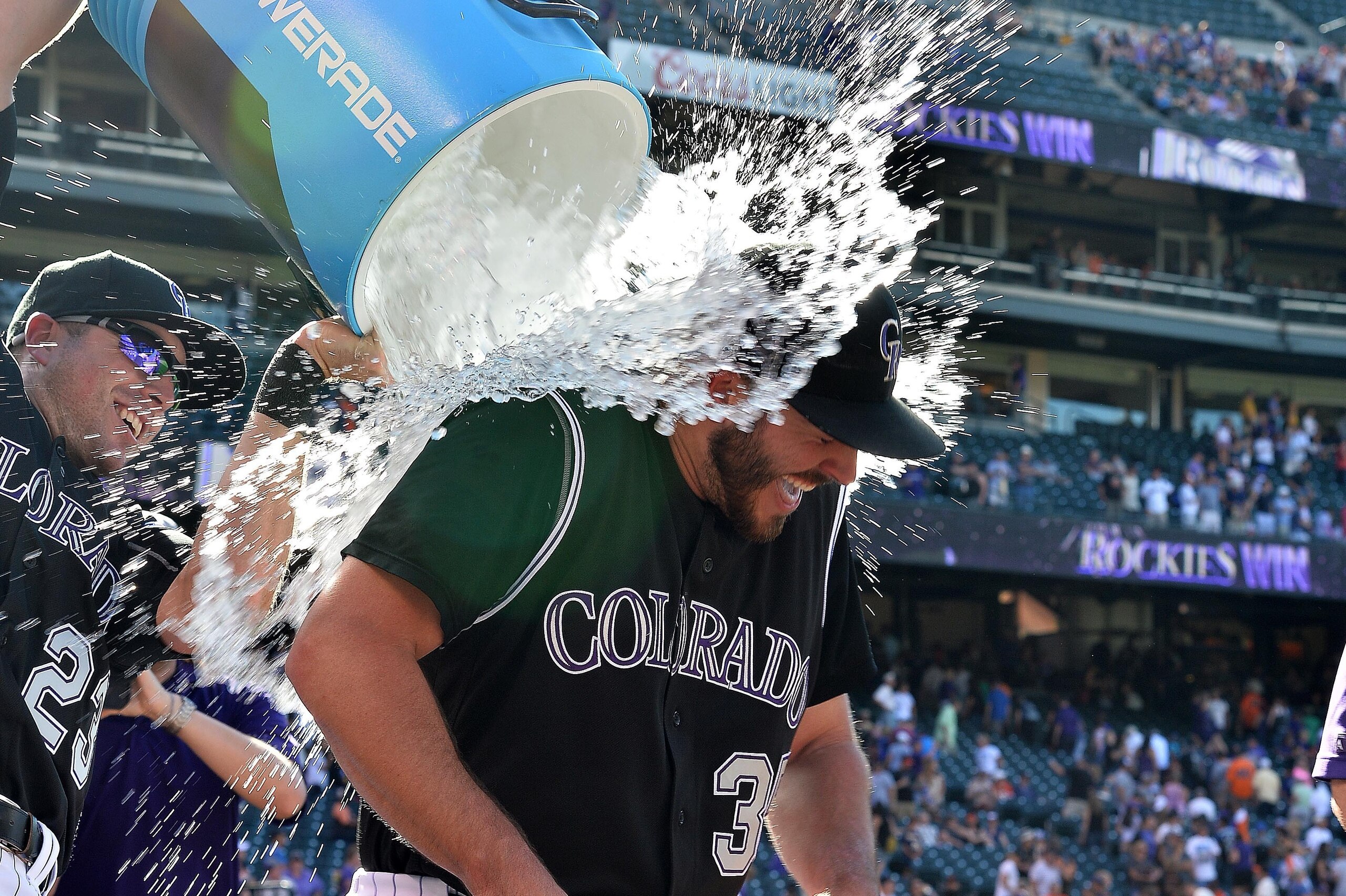 Sep 5, 2016; Denver, CO, USA; Colorado Rockies starting pitcher Chad Bettis (35) is dunked with ice water by catcher Tom Murphy (23) following a win over the San Francisco Giants at Coors Field. Mandatory Credit: Ron Chenoy-USA TODAY Sports