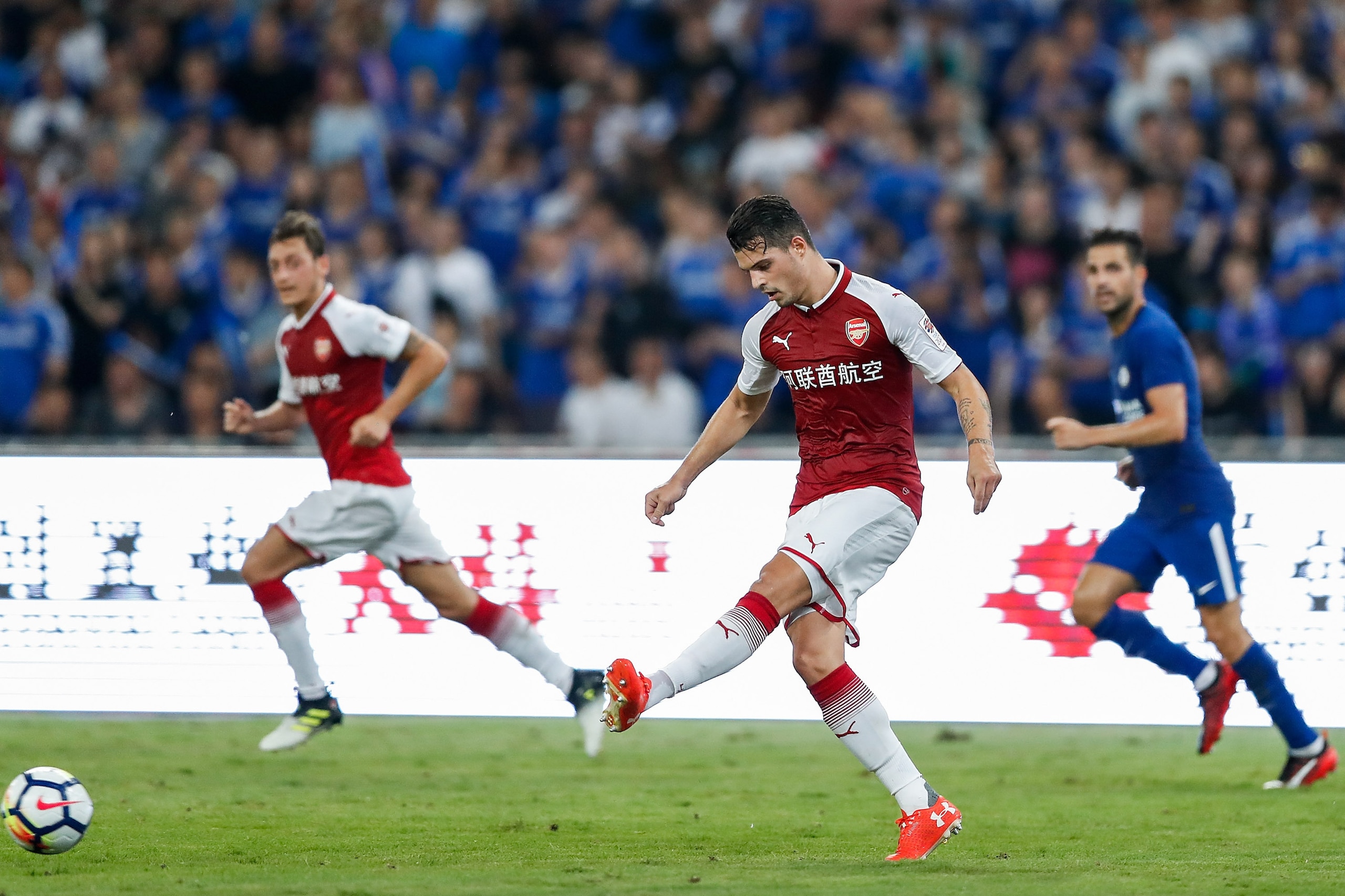 BEIJING, CHINA - JULY 22:  Granit Xhaka passes during the Pre-Season Friendly match between Arsenal FC and Chelsea FC at Birds Nest on July 22, 2017 in Beijing, China.  (Photo by Yifan Ding/Getty Images )