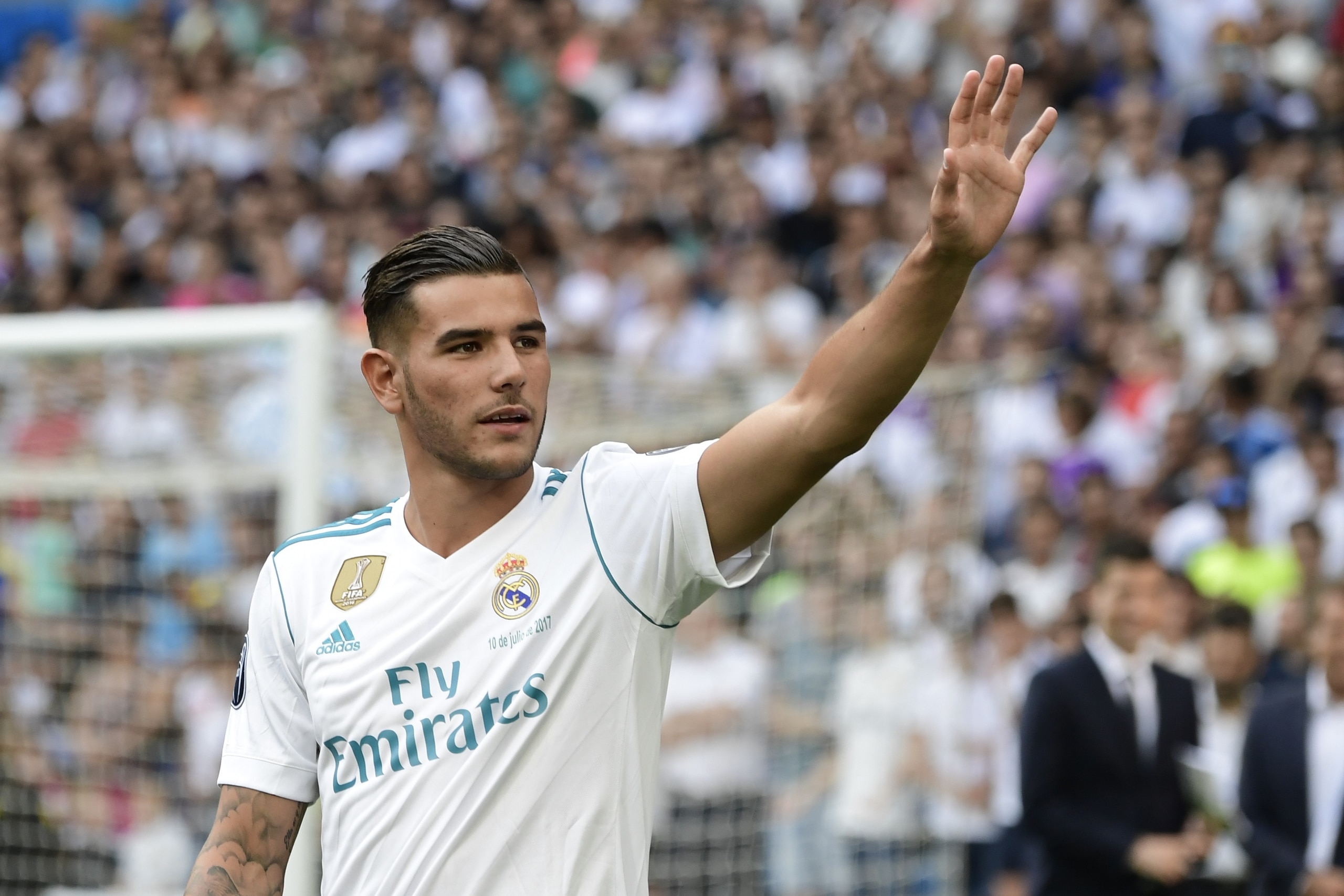 Real Madrid's French new player Theo Hernandez greets to supporters during his presentation at the Santiago Bernabeu stadium in Madrid, on July 10, 2017. / AFP PHOTO / JAVIER SORIANO        (Photo credit should read JAVIER SORIANO/AFP/Getty Images)