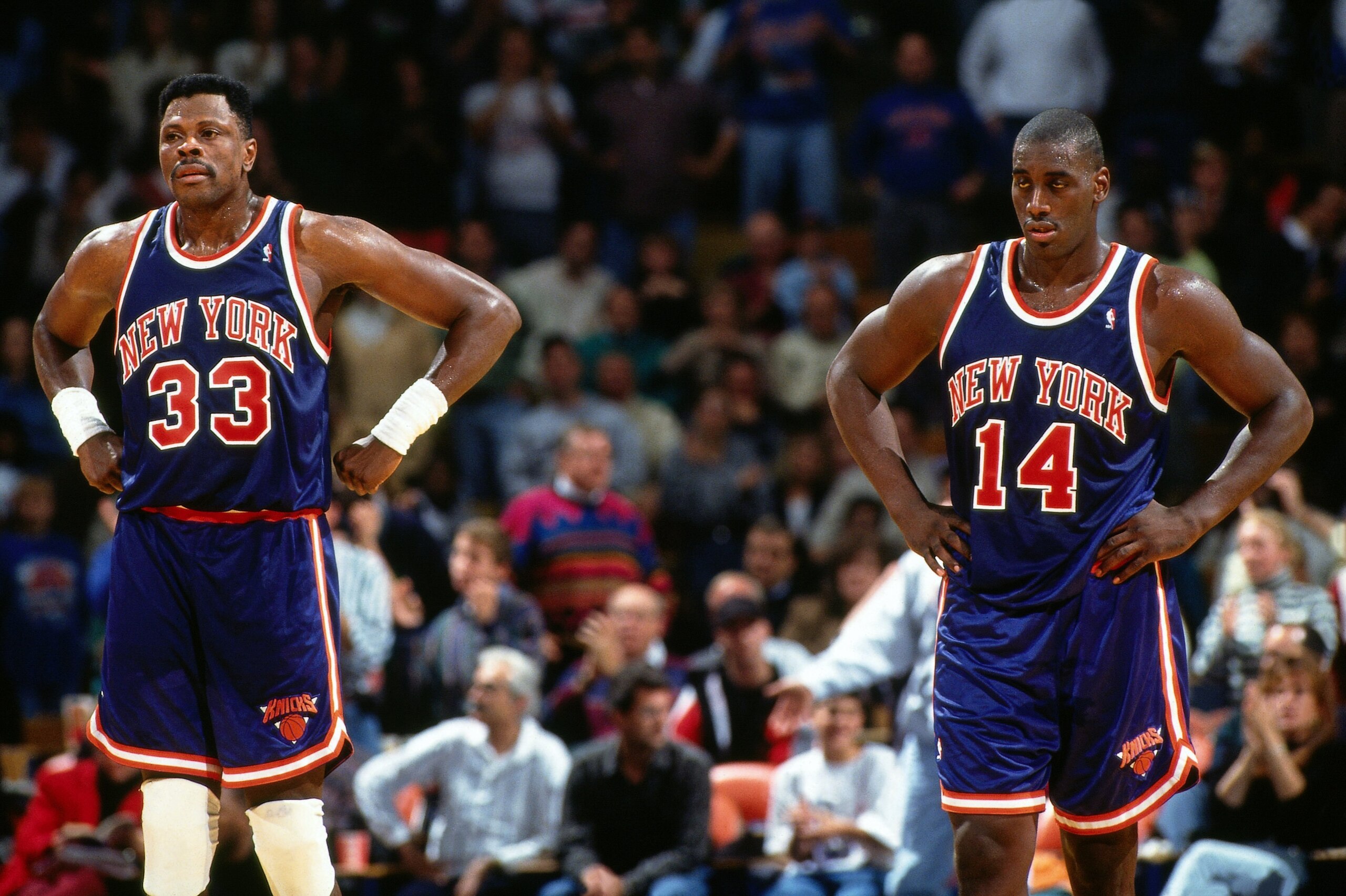 RICHFIELD, OH - NOVEMBER 7:  Patrick Ewing #33 and Anthony Mason #14 of the New York Knicks look on during a game against the Cleveland Cavaliers at the Richfield Coliseum on November 7, 1993 in Richfield, Ohio.  NOTE TO USER: User expressly acknowledges 