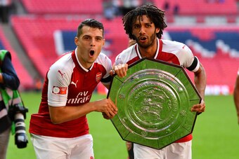 LONDON, ENGLAND - AUGUST 06:  Granit Xhaka of Arsenal and Mohamed Elneny of Arsenal celebrate with the trophy following the The FA Community Shield final between Chelsea and Arsenal at Wembley Stadium on August 6, 2017 in London, England.  (Photo by Dan M