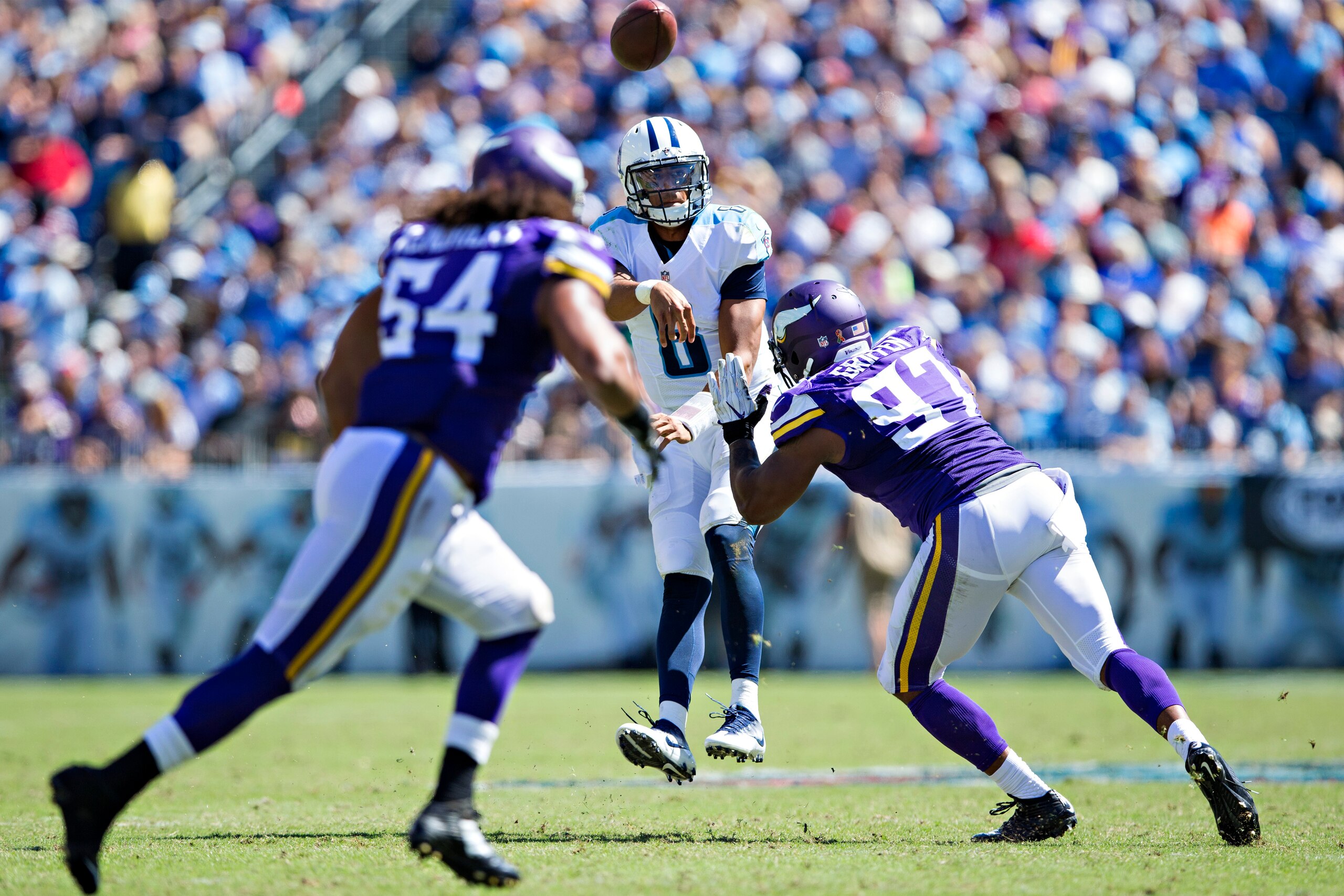 NASHVILLE, TN - SEPTEMBER 11:  Marcus Mariota #8 of the Tennessee Titans throws a interception while under pressure from Everson Griffen #97 to Eric Kendricks #54 of the Minnesota Vikings at Nissan Stadium on September 11, 2016 in Nashville, Tennessee. Th