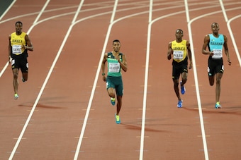 LONDON, ENGLAND - AUGUST 08:  Wayde van Niekerk of South Africa on his way to winning the Men's 400 metres final ahead of Demish Gaye of Jamaica (l), Nathon Allen of Jamaica and Steven Gardiner of Bahamas during day five of the 16th IAAF World Athletics C