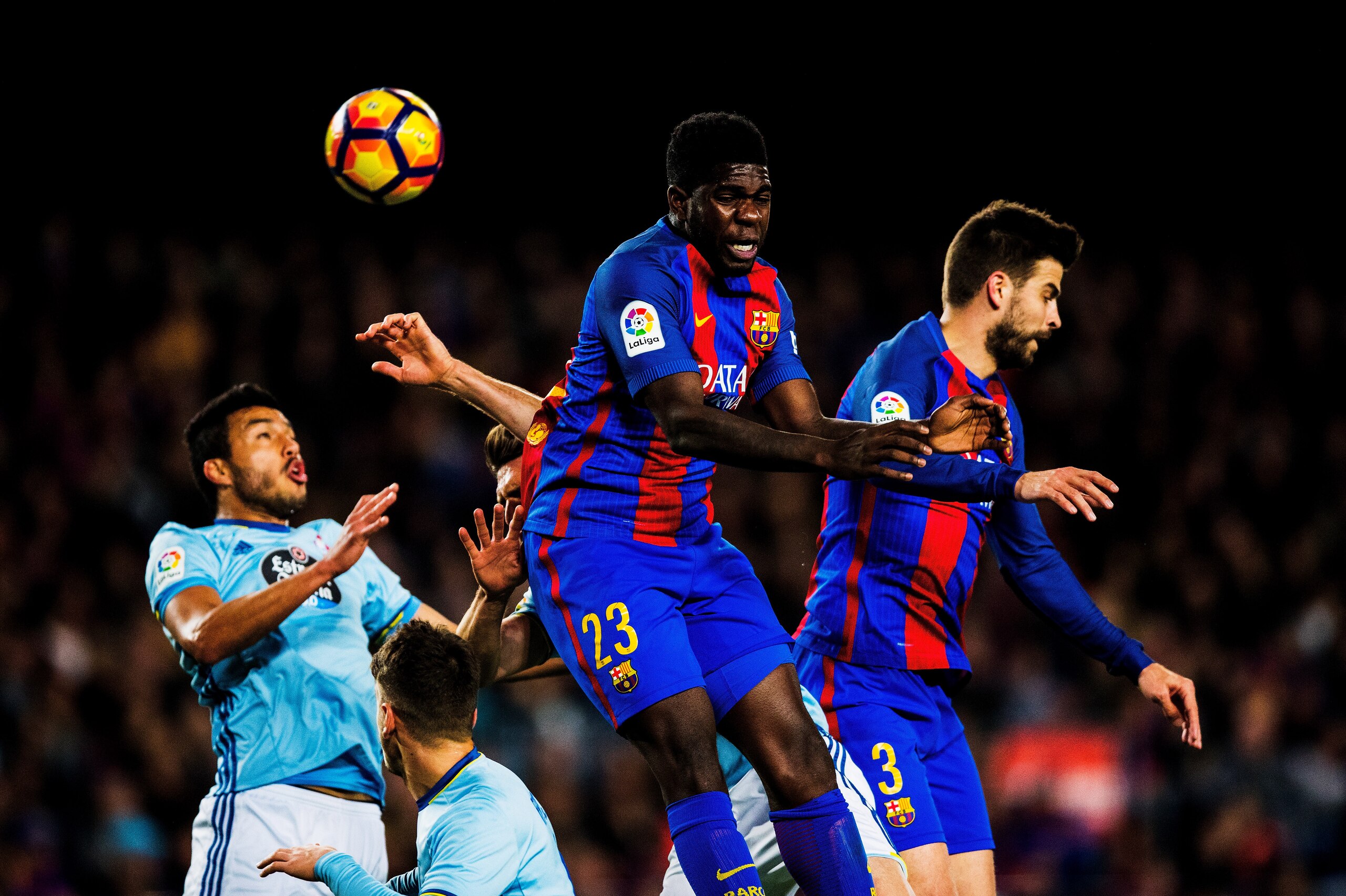 BARCELONA, SPAIN - MARCH 04: Samuel Umtiti and Gerald Pique (R) of Barcelona vie for a header during the La Liga match between FC Barcelona and RC Celta de Vigo at Camp Nou on March 04, 2017 in Barcelona, Spain.  (Photo by Vladimir Rys Photography via Get