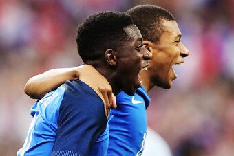 PARIS, FRANCE - JUNE 13: Ousmane Dembele of France  celebrates with Kylian Mbappe of France after he scores his team's third goal during the international Friendly match between France and England at Stade de France, on June 13, 2017 in Paris, France. (Ph