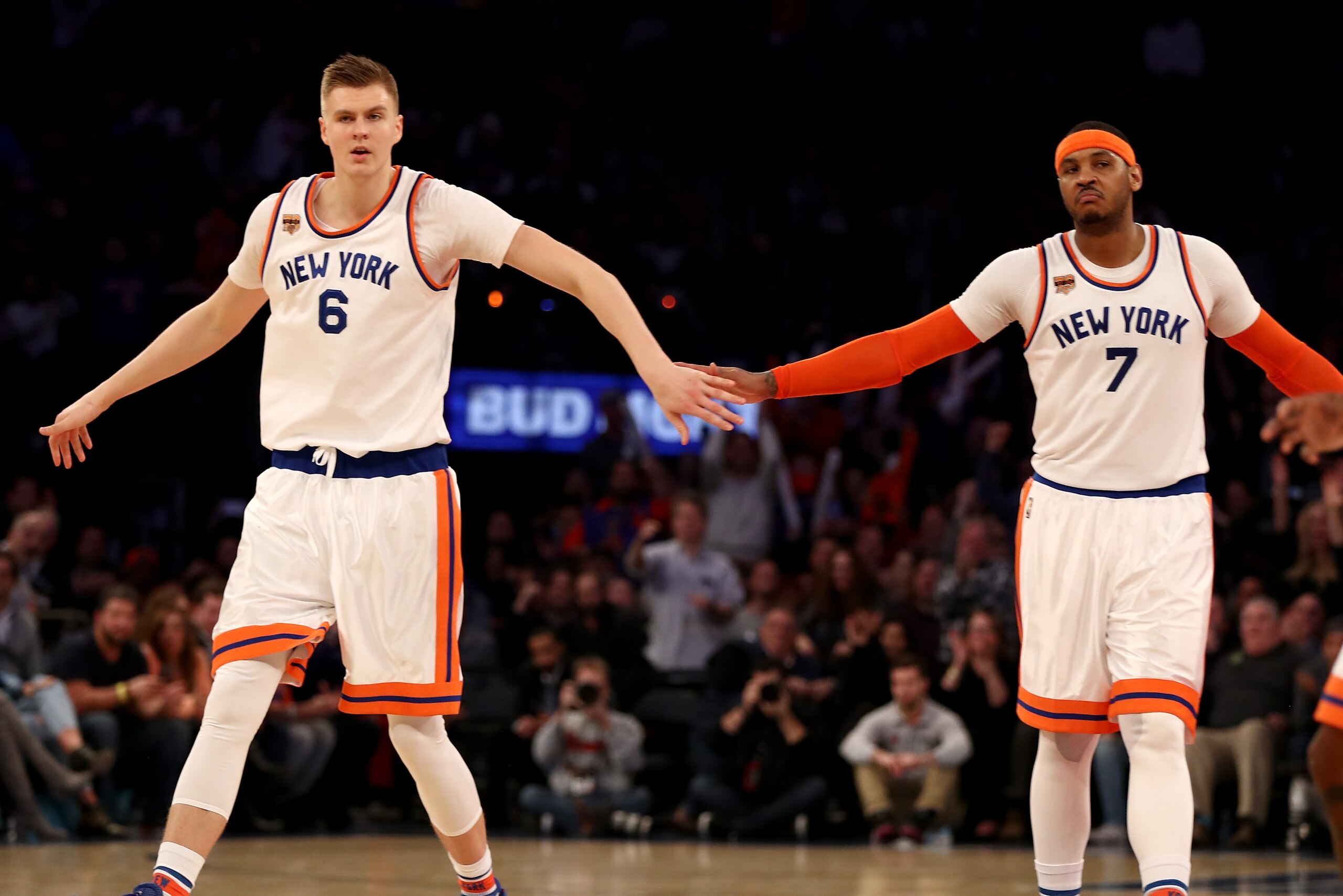 NEW YORK, NY - JANUARY 27:  Kristaps Porzingis #6 and Carmelo Anthony #7 of the New York Knicks celebrate in the fourth quarter against the Charlotte Hornets at Madison Square Garden on January 27, 2017 in New York City. NOTE TO USER: User expressly ackno