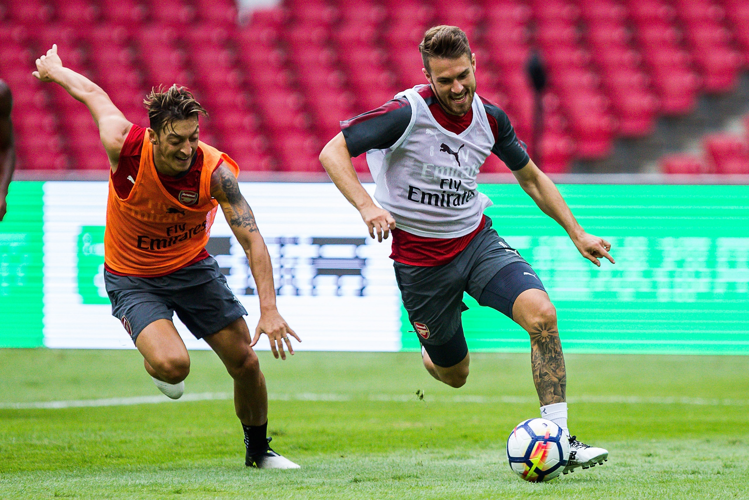 BEIJING, CHINA - JULY 21: Mesut Ozil and Aaron Ramsey fight for the ball during a training session at Birds Nest on July 21, 2017 in Beijing, China. (Photo by Yifan Ding/Getty Images) BEIJING, CHINA - JULY 21: Mesut Ozil and Aaron Ramsey fight for the ball during a training session at Birds Nest on July 21, 2017 in Beijing, China. (Photo by Yifan Ding/Getty Images)