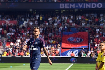 Paris Saint-Germain's Brazilian forward Neymar looks on during his presentation to the fans at the Parc des Princes stadium in Paris on August 5, 2017. 
Brazil superstar Neymar will watch from the stands as Paris Saint-Germain open their season on August 