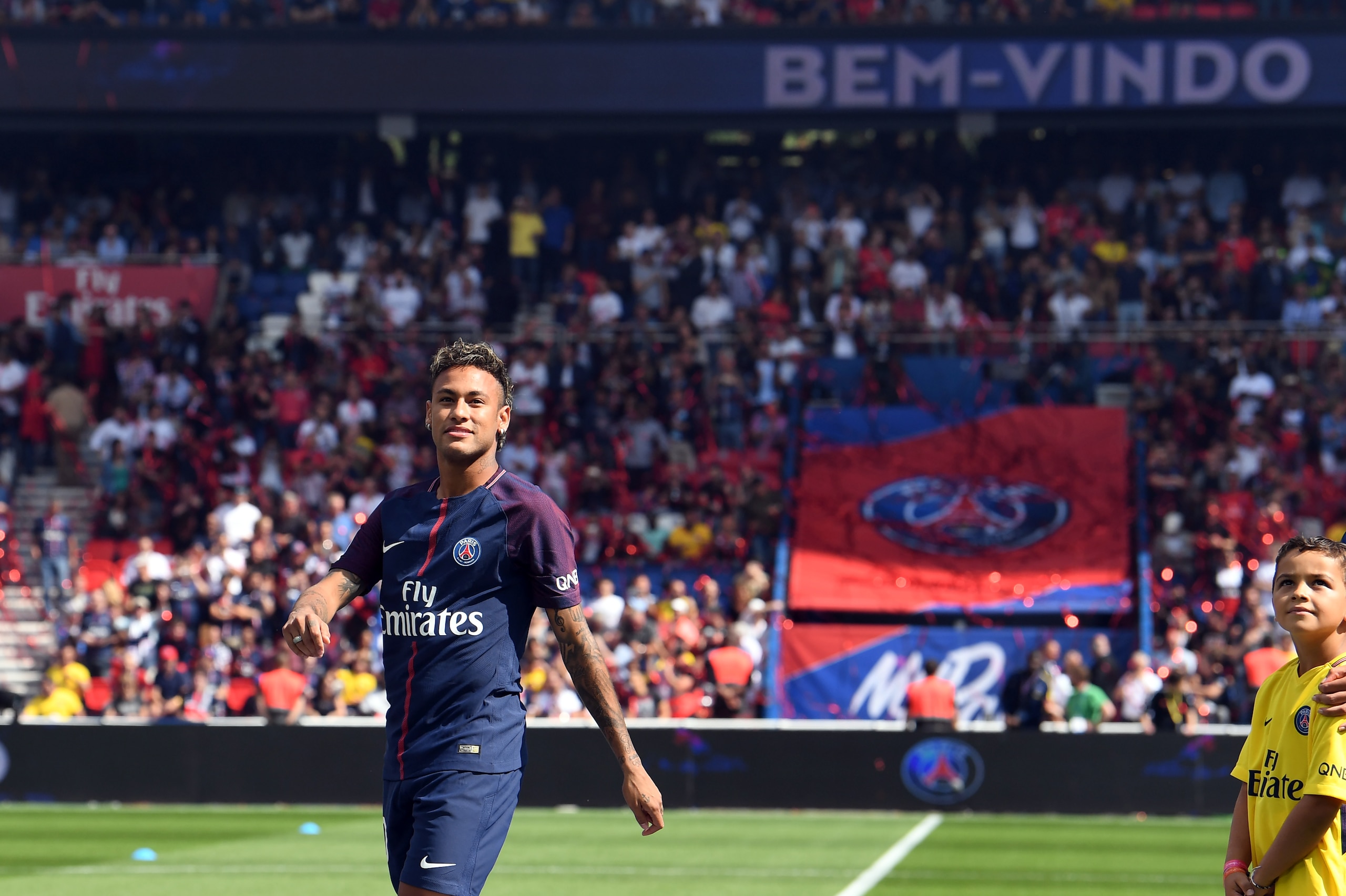 Paris Saint-Germain's Brazilian forward Neymar looks on during his presentation to the fans at the Parc des Princes stadium in Paris on August 5, 2017. 
Brazil superstar Neymar will watch from the stands as Paris Saint-Germain open their season on August 