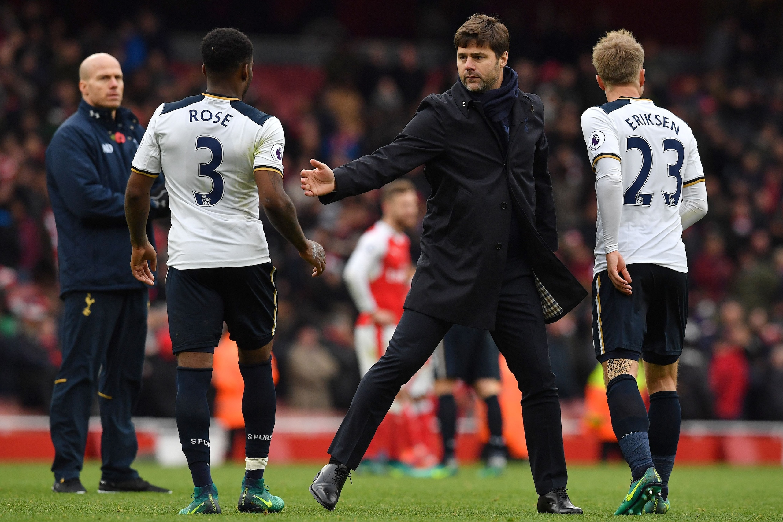Tottenham Hotspur's Argentinian head coach Mauricio Pochettino (2R) congratulates Tottenham Hotspur's English defender Danny Rose (2L) and Tottenham Hotspur's Danish midfielder Christian Eriksen (R) following the English Premier League football match betw